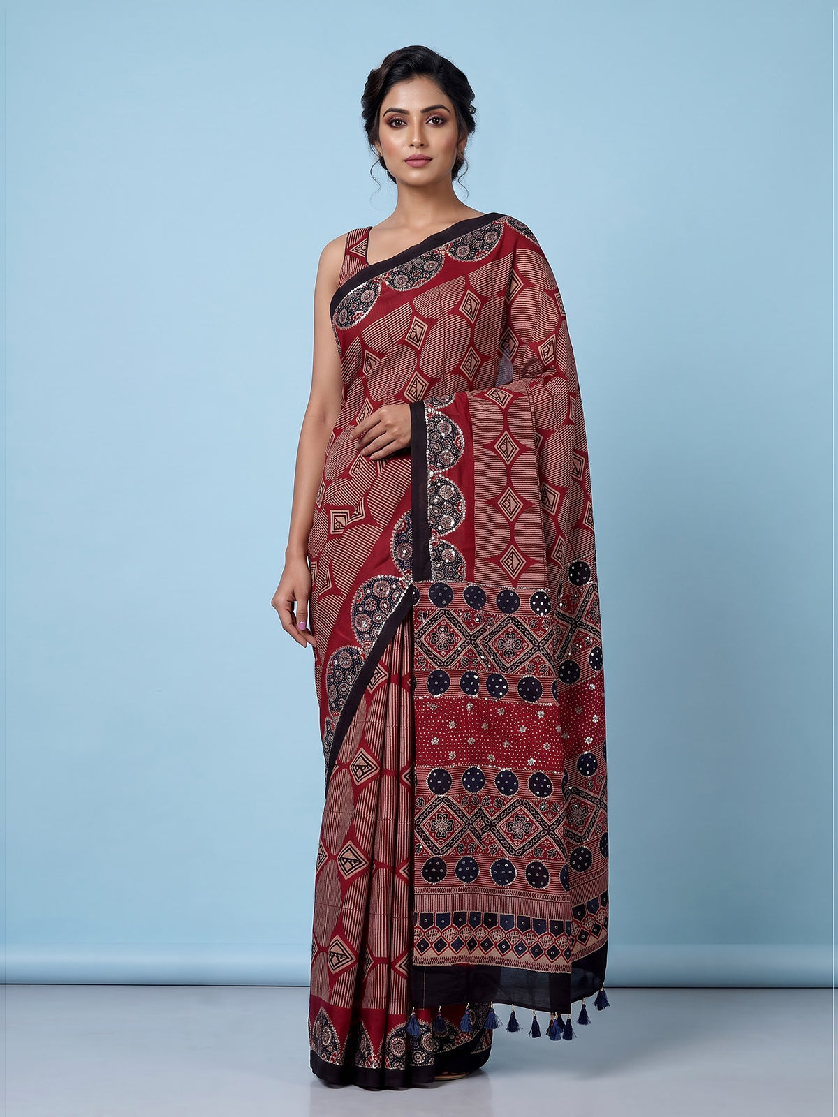 Maroon crepe silk saree with elegant sequin printed artistry