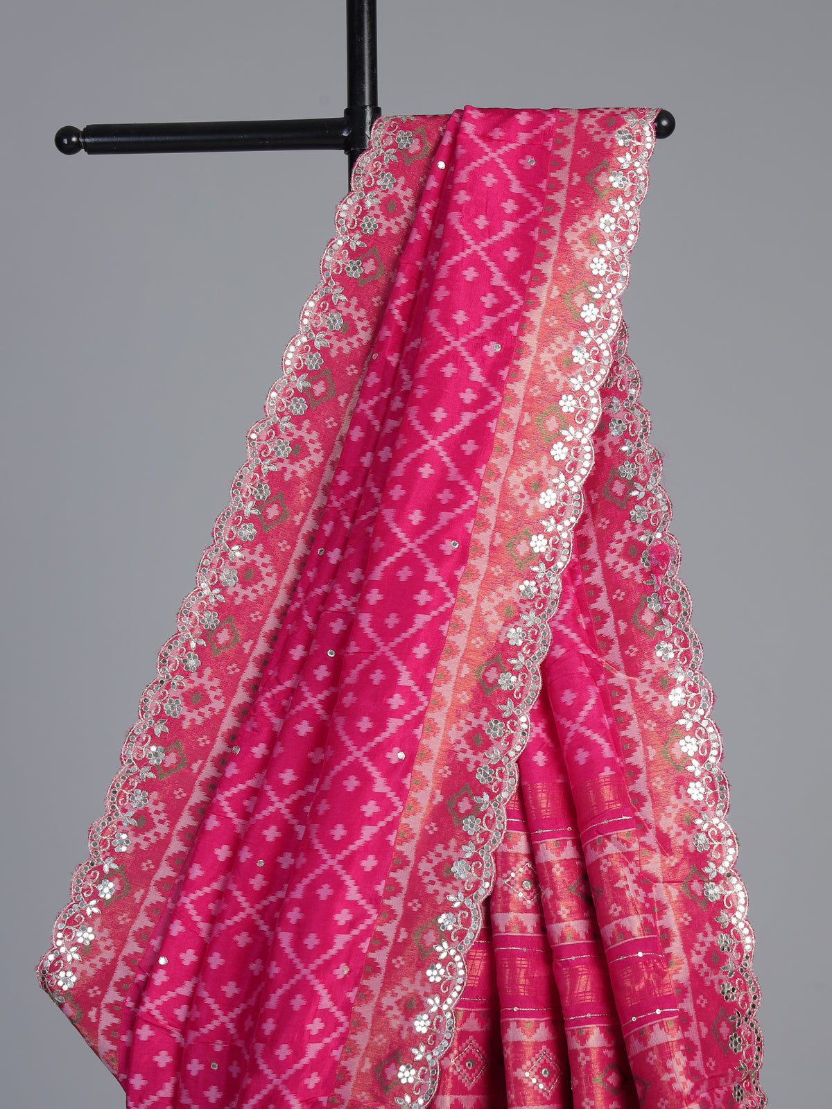 Rani pink soft silk saree with sparkling ikat printed elegance