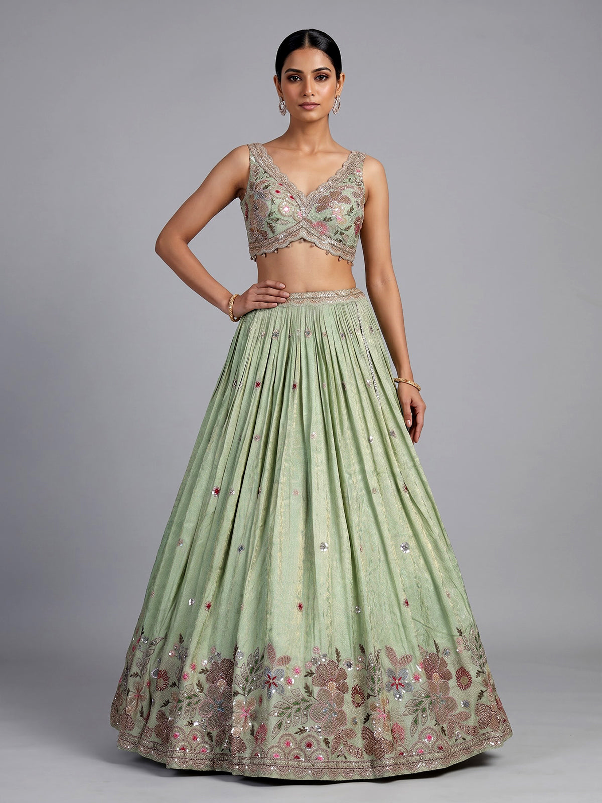Pista green silk lehenga with zardosi festive detailing