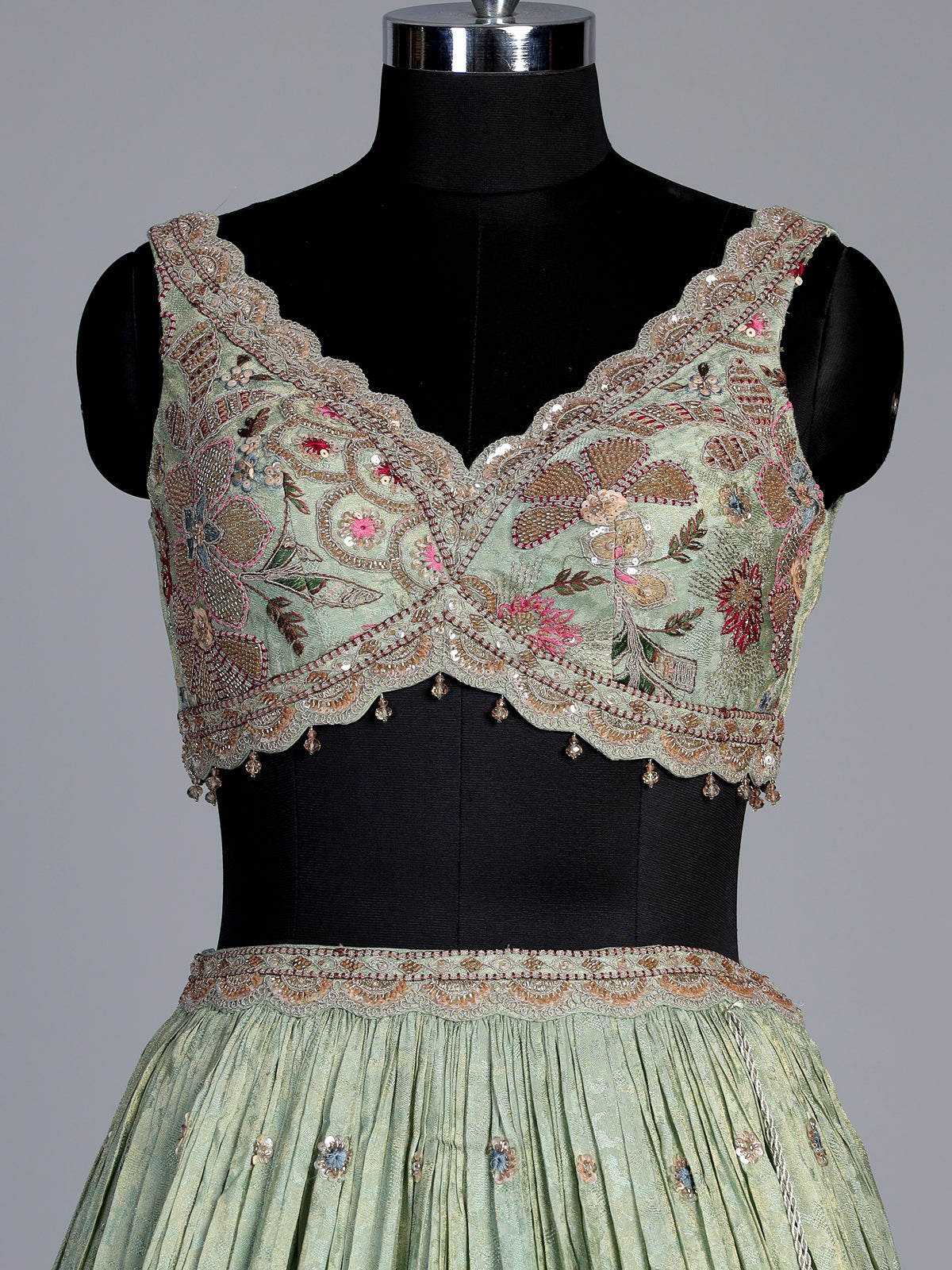 Pista green silk lehenga with zardosi festive detailing