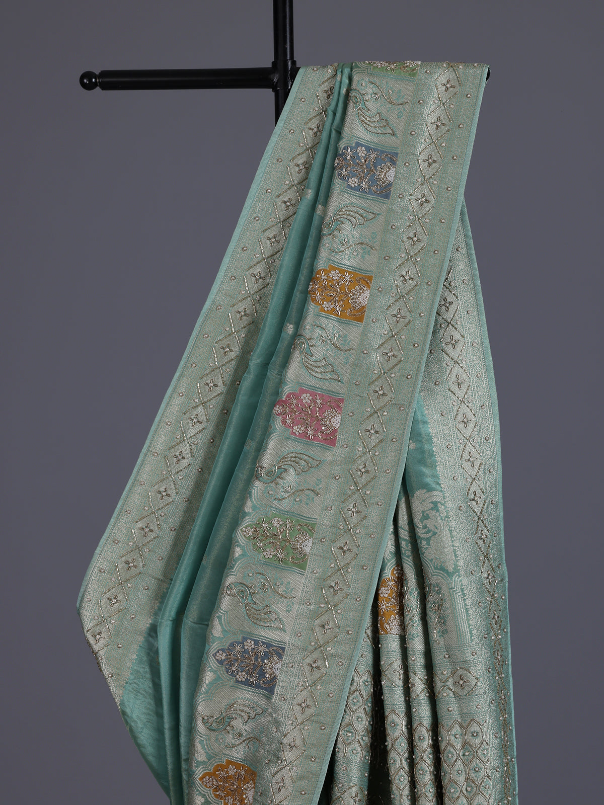 Mint blue silk saree with elegant peacock motif work