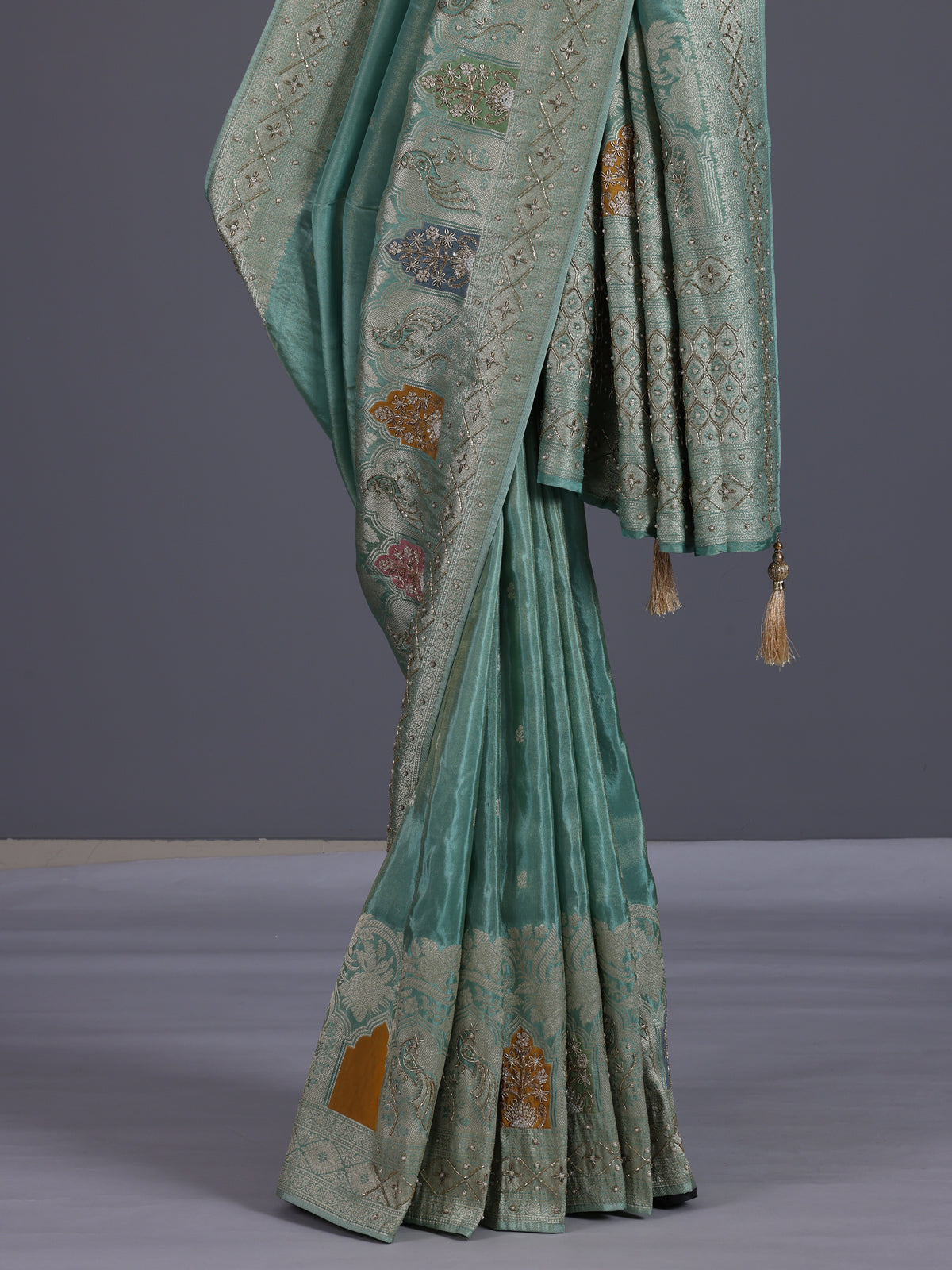 Mint blue silk saree with elegant peacock motif work