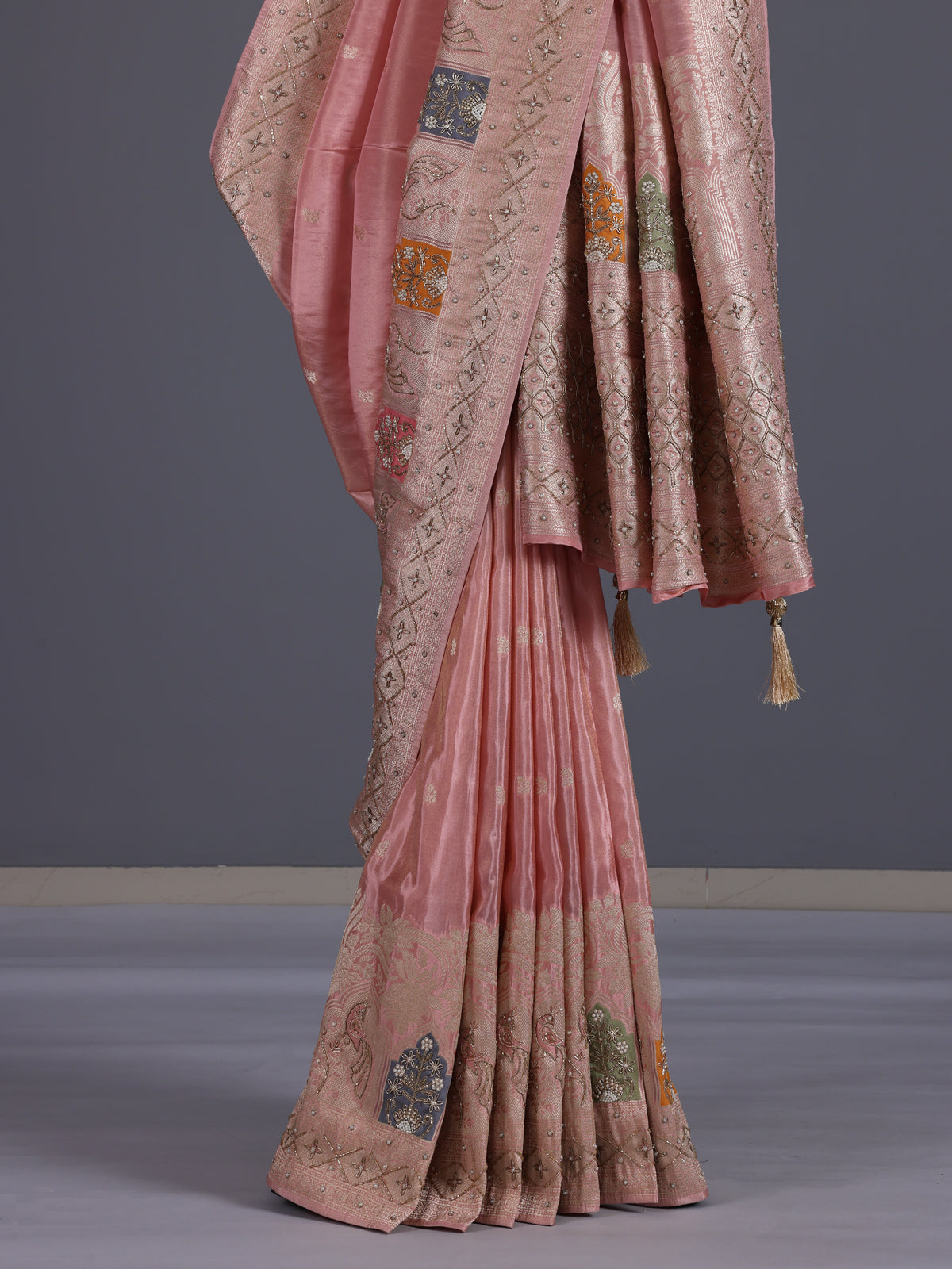 Pink silk saree with graceful peacock motif embellishments