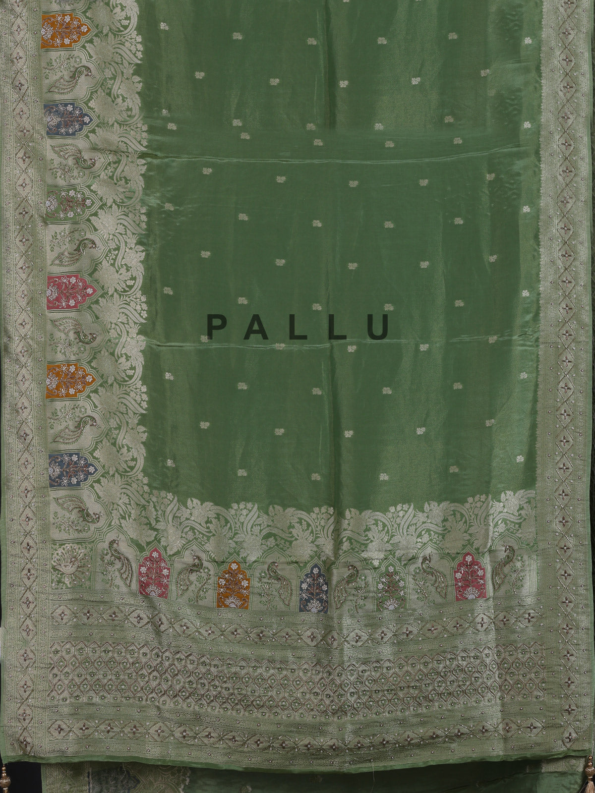 Pista green silk saree with elegant peacock motif embellishments