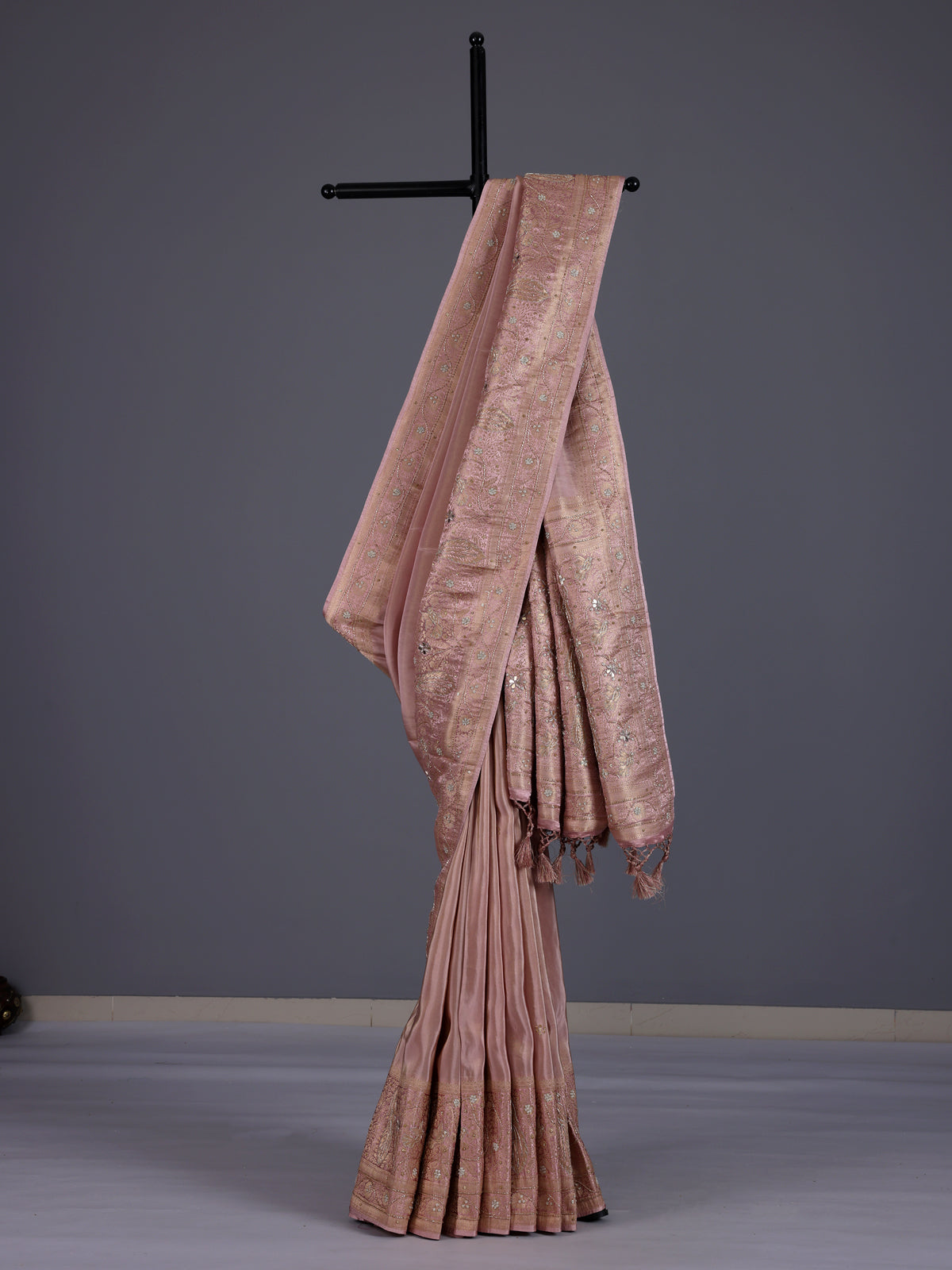 Onion pink silk saree with graceful traditional pallu tassels