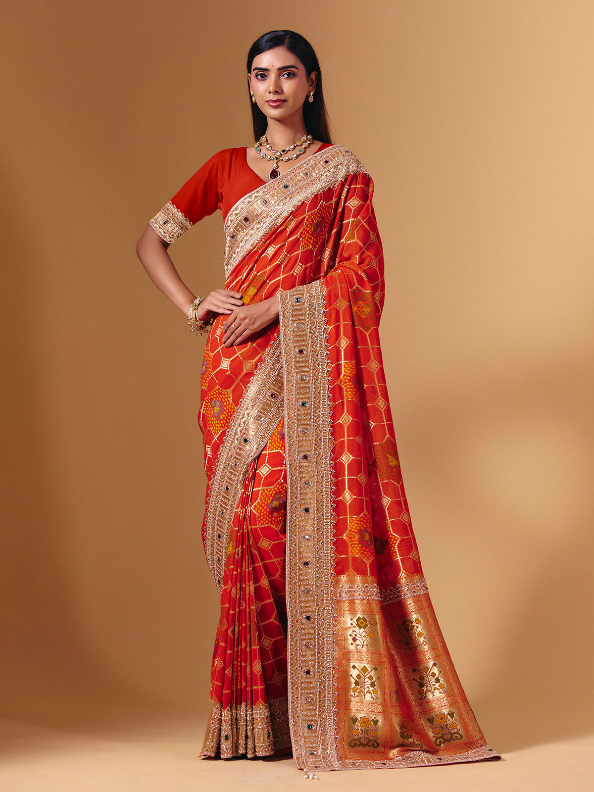 Orange georgette saree with sparkling animal motif detailing