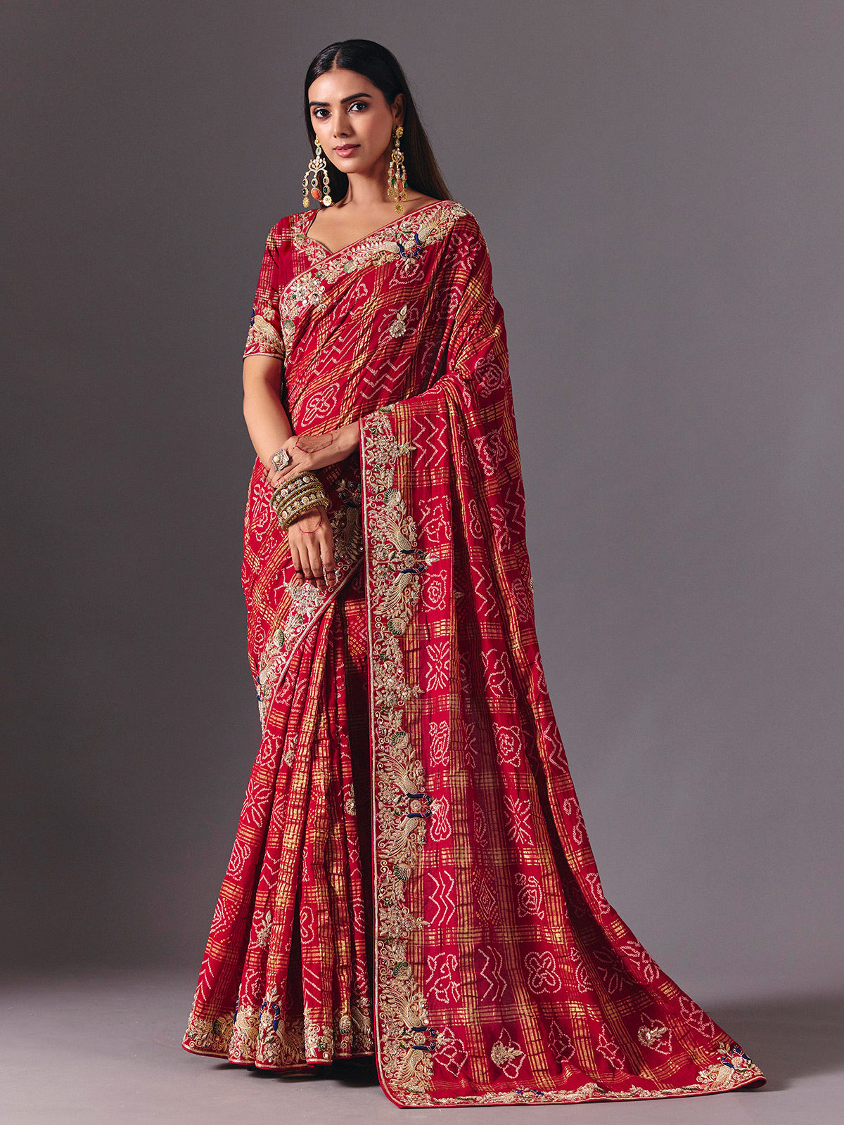 Maroon gharchola silk saree with peacock motif embellishments