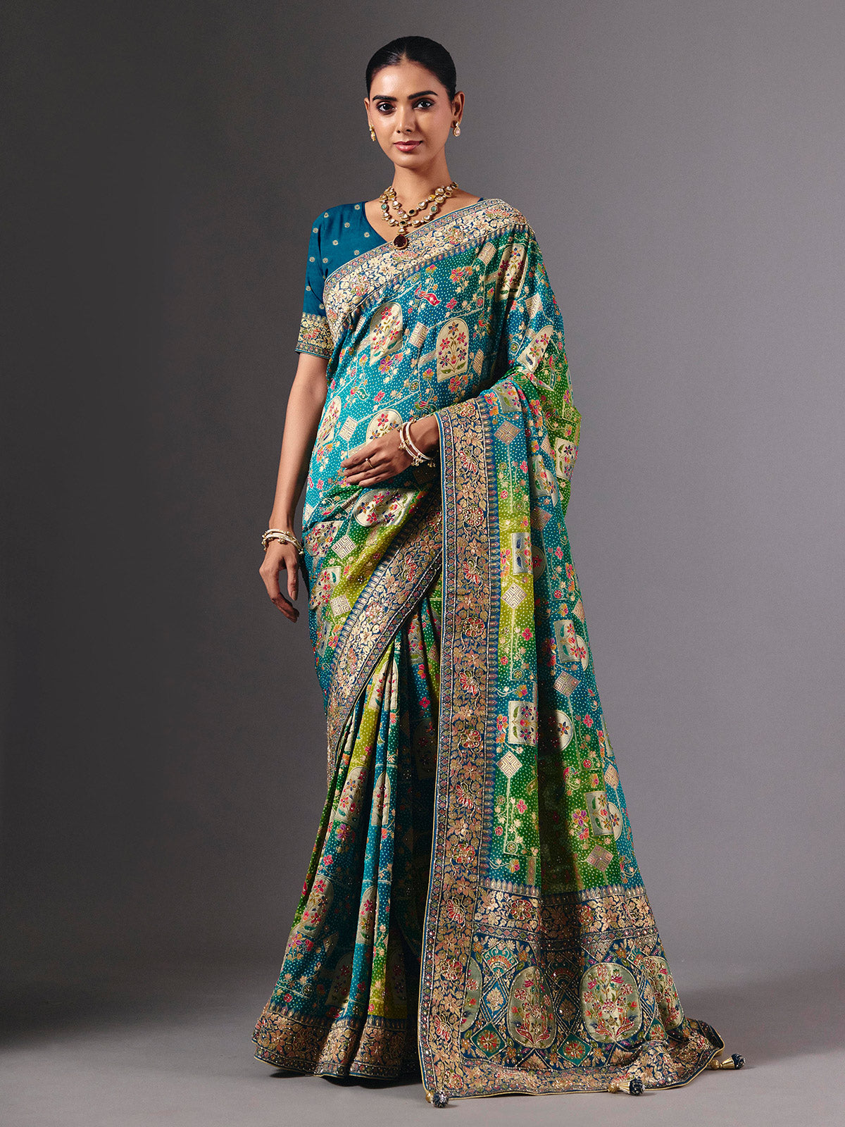 Blue dola silk saree with elegant peacock motif embellishments