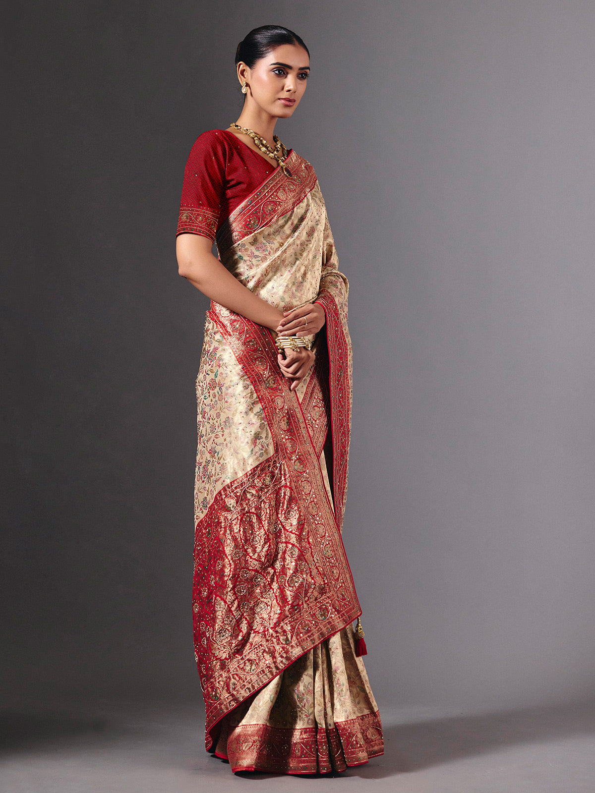 Beige shimmer dola silk saree with floral zari artistry