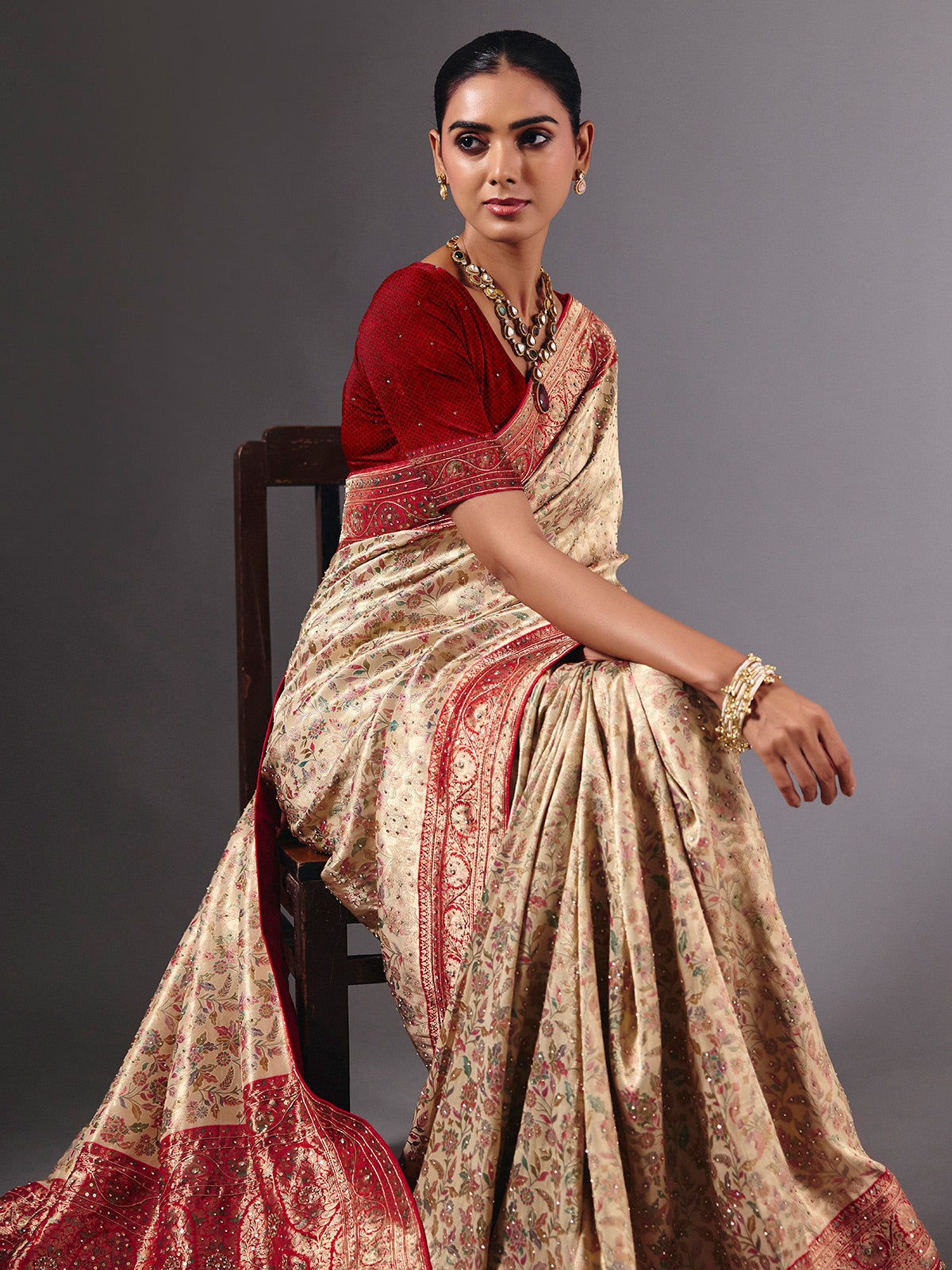Beige shimmer dola silk saree with floral zari artistry