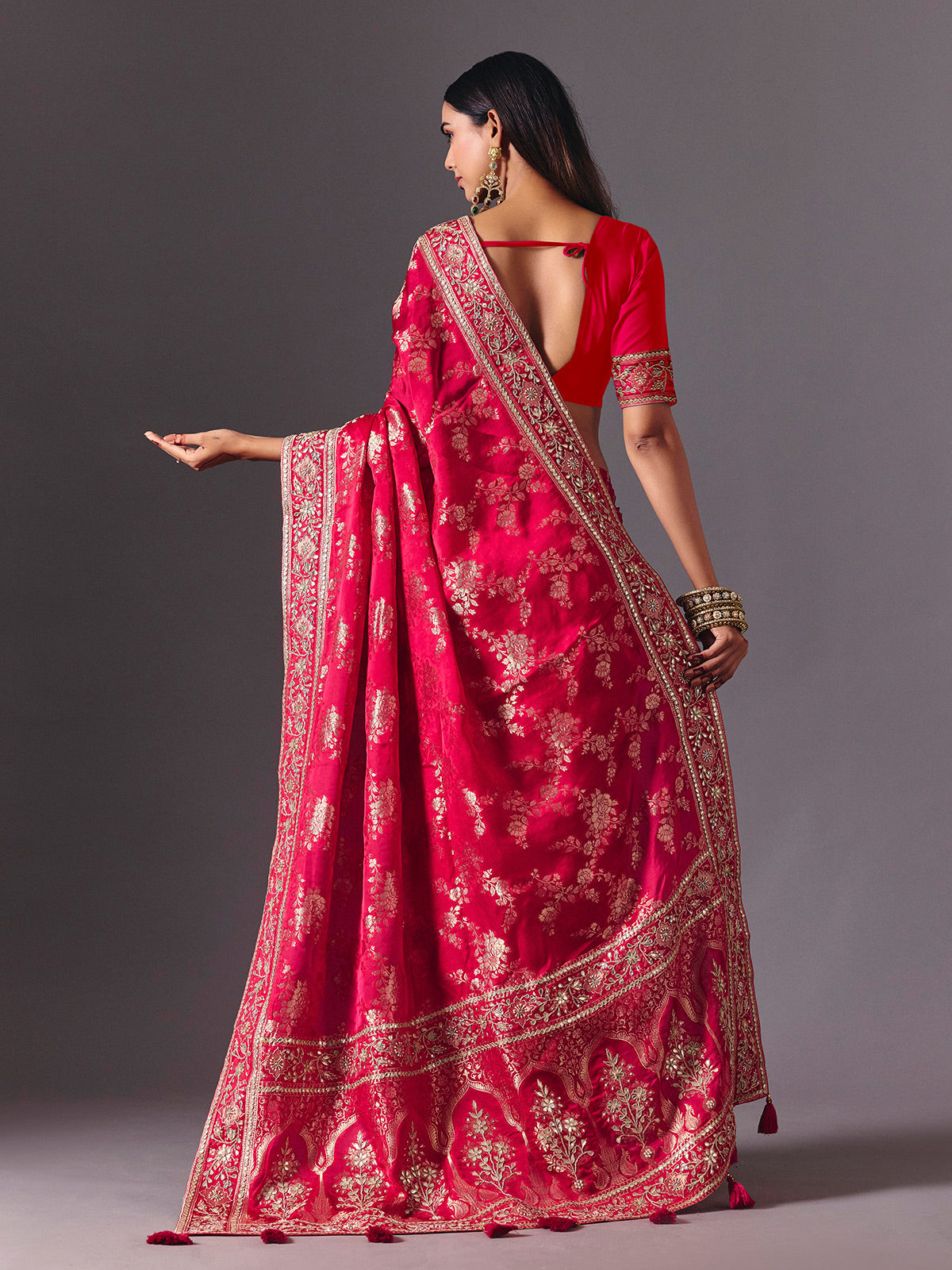 Rani pink satin silk saree with luxurious zari embellishments