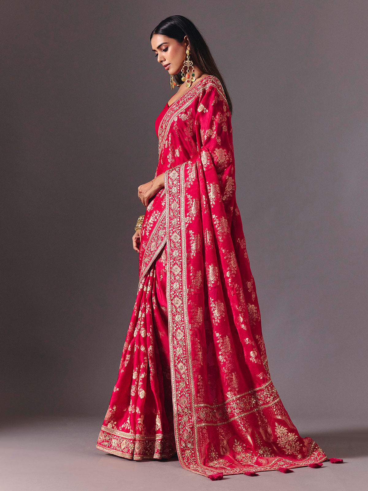 Rani pink satin silk saree with luxurious zari embellishments