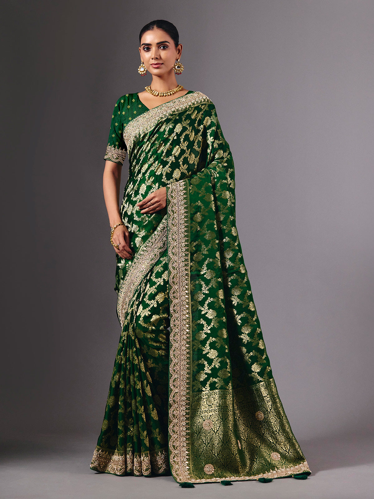 Green satin silk saree with ornate zari tassel detailing