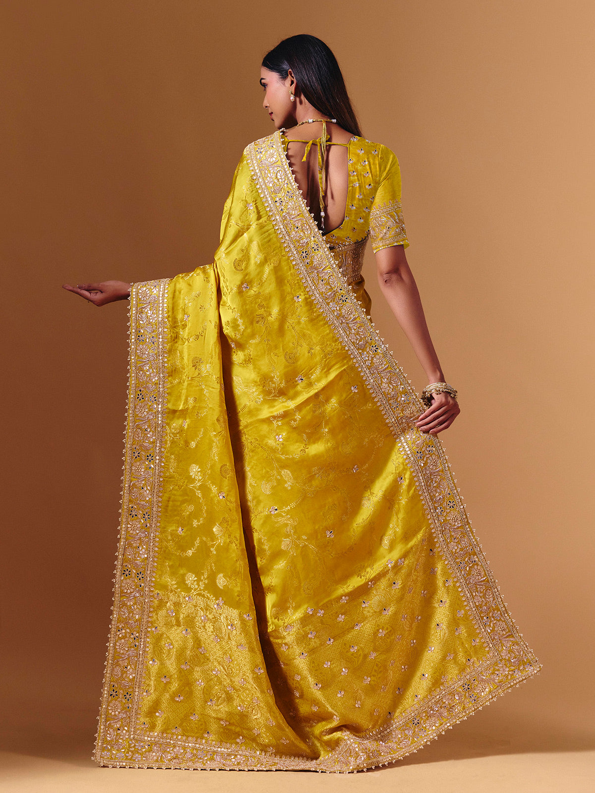 Yellow satin silk saree with elegant mirror zari artistry