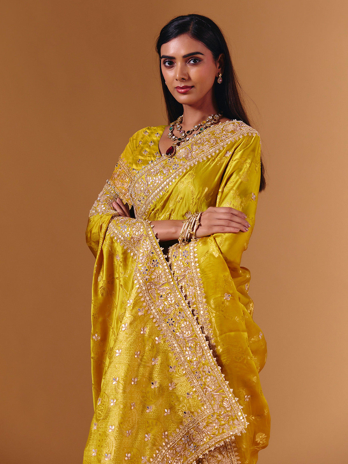 Yellow satin silk saree with elegant mirror zari artistry