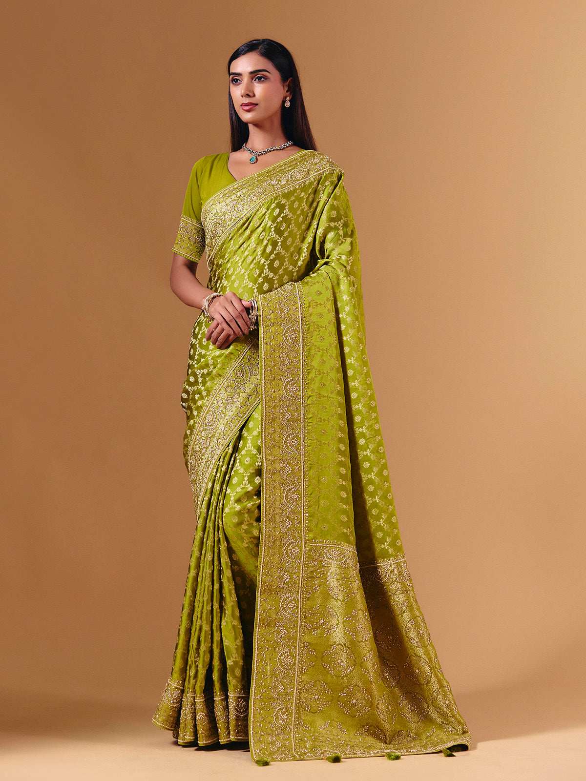 Bright green modal silk saree with dazzling zari detailing