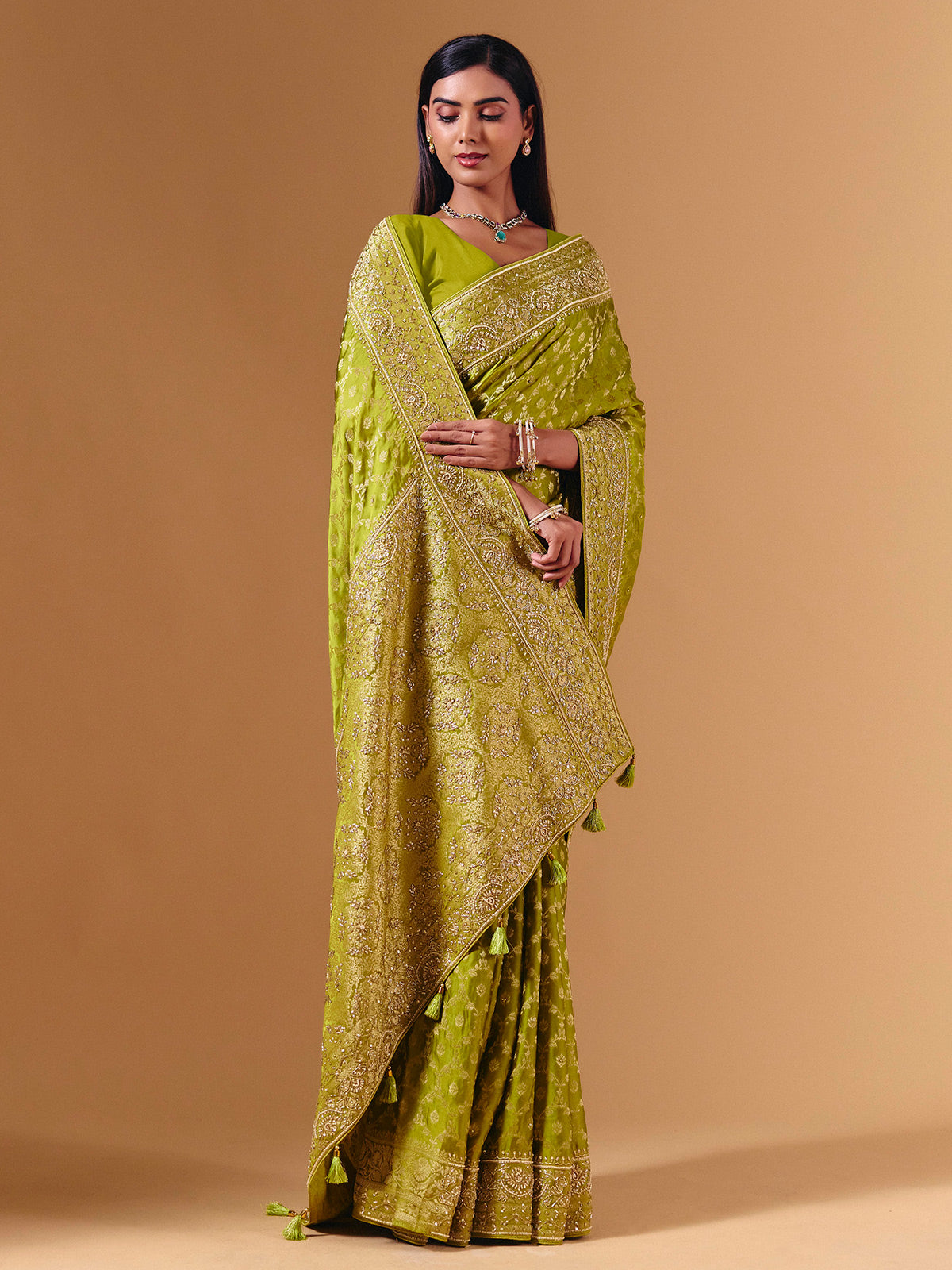 Bright green modal silk saree with dazzling zari detailing
