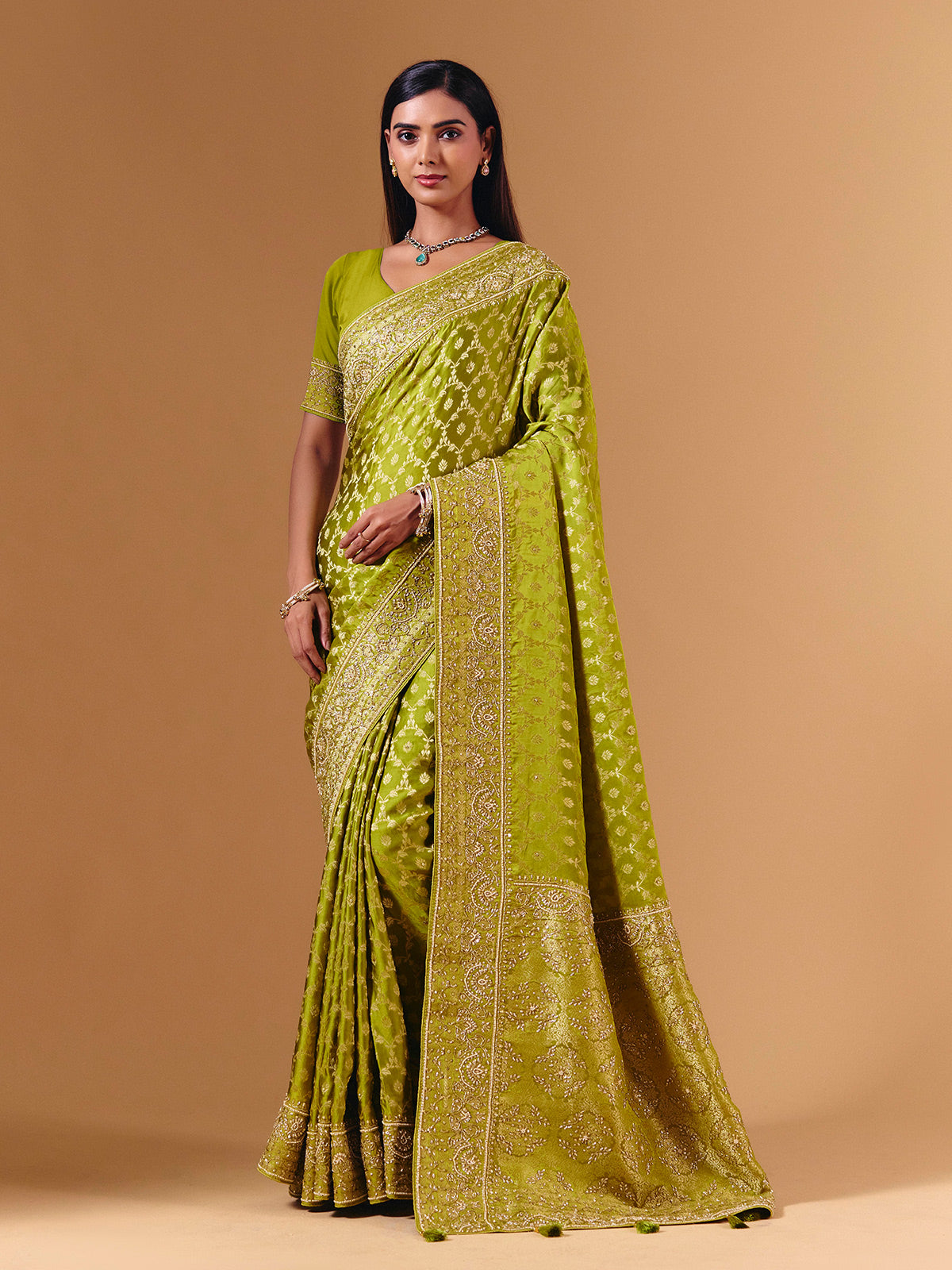Bright green modal silk saree with dazzling zari detailing