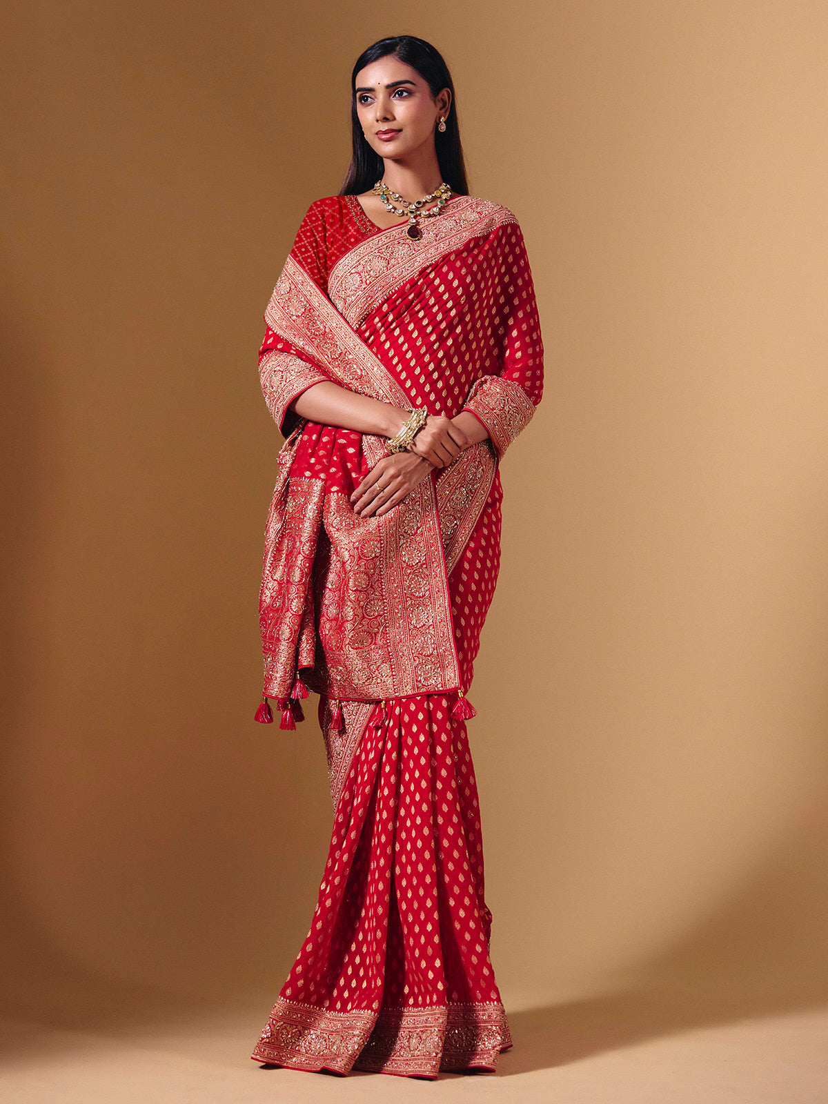 Red dola silk saree with exquisite zari butti embellishments