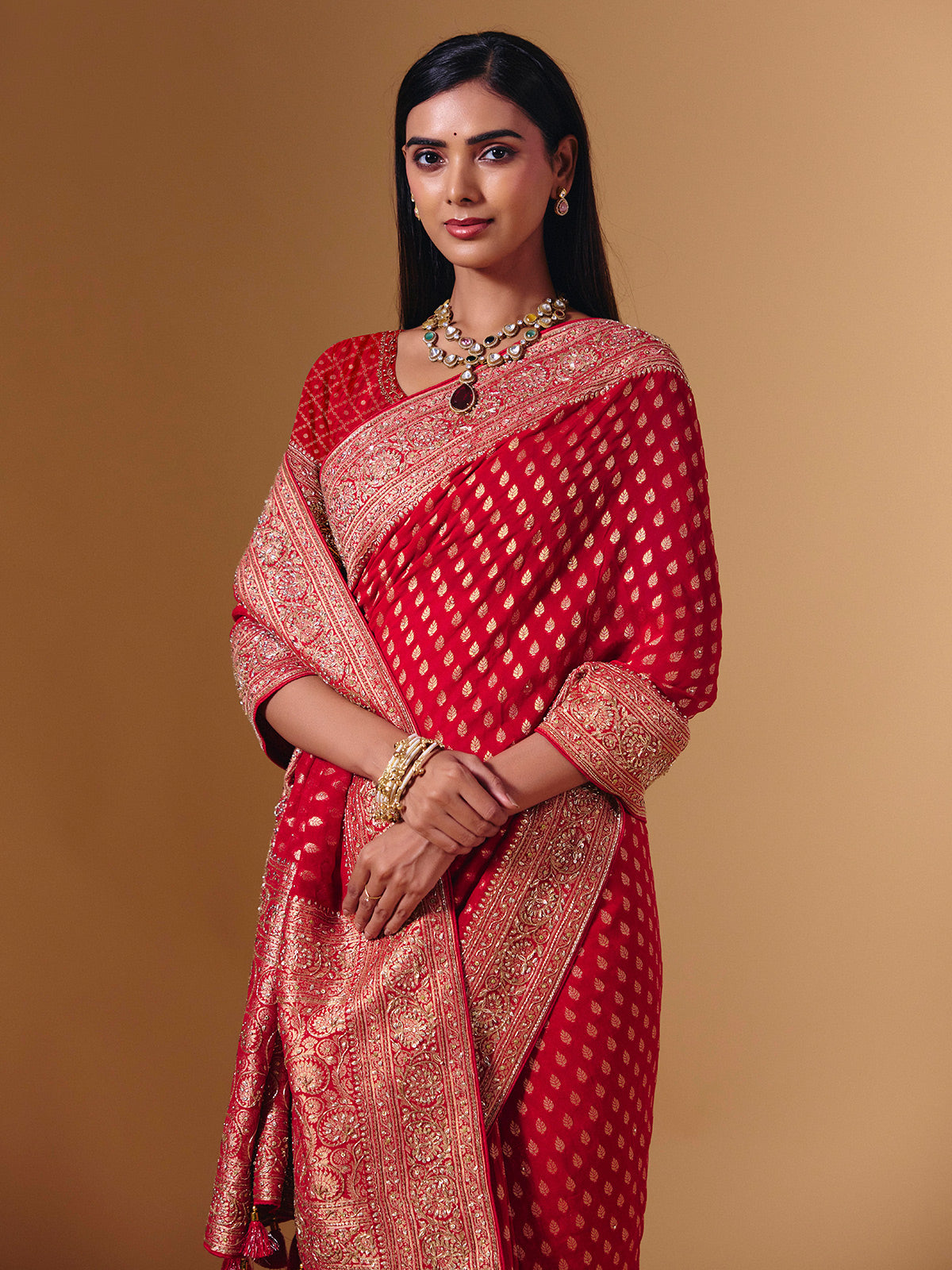 Red dola silk saree with exquisite zari butti embellishments