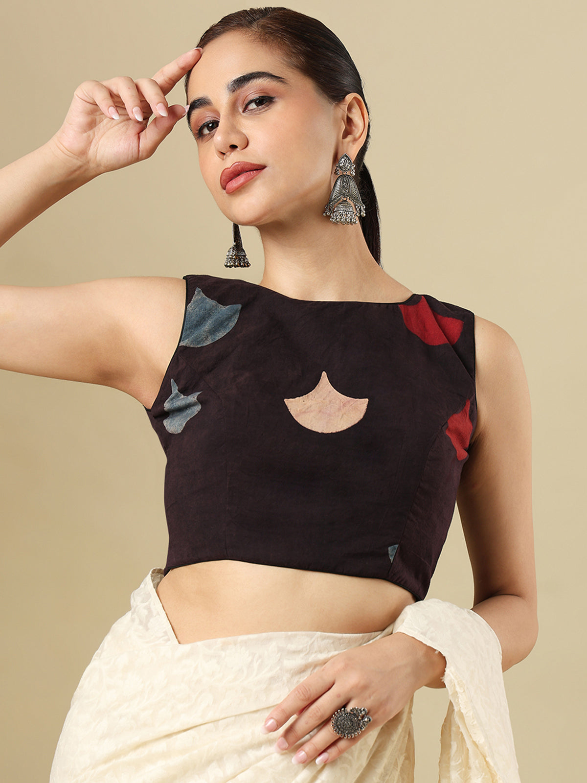 Black cotton printed blouse with boat neckline and sleeveless styling