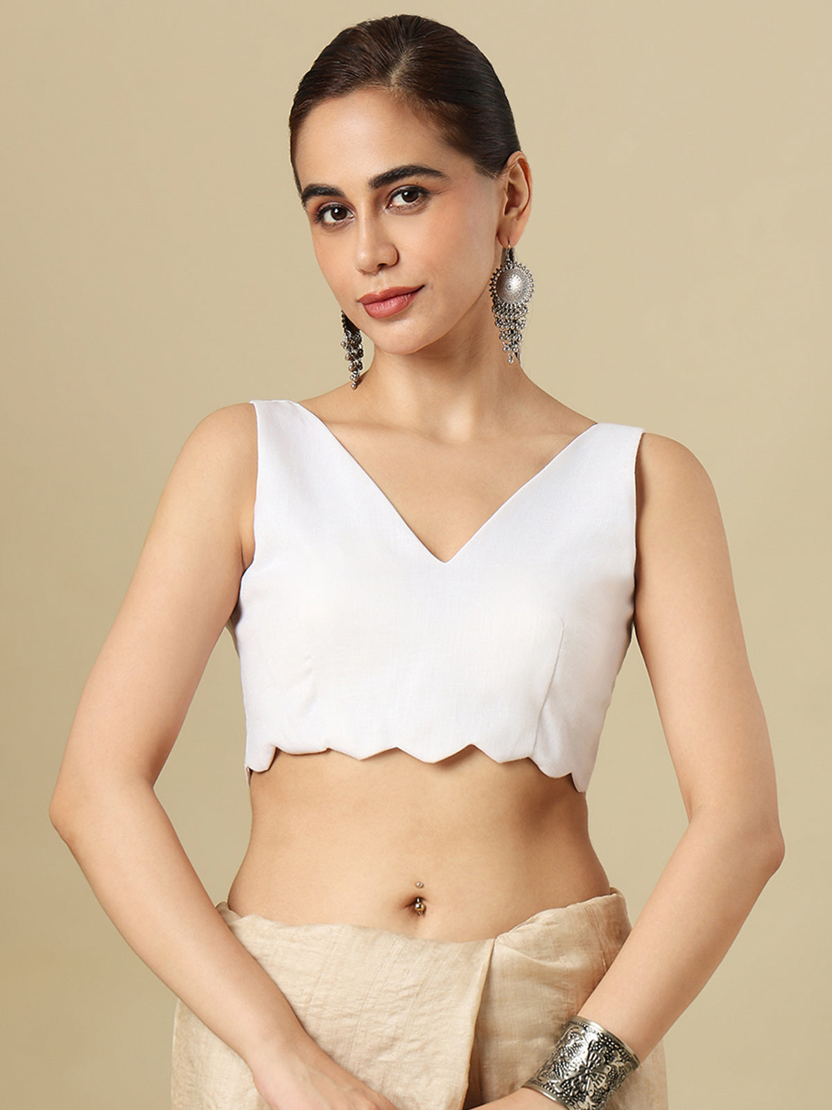 White linen solid blouse with V neck and sleeveless silhouette