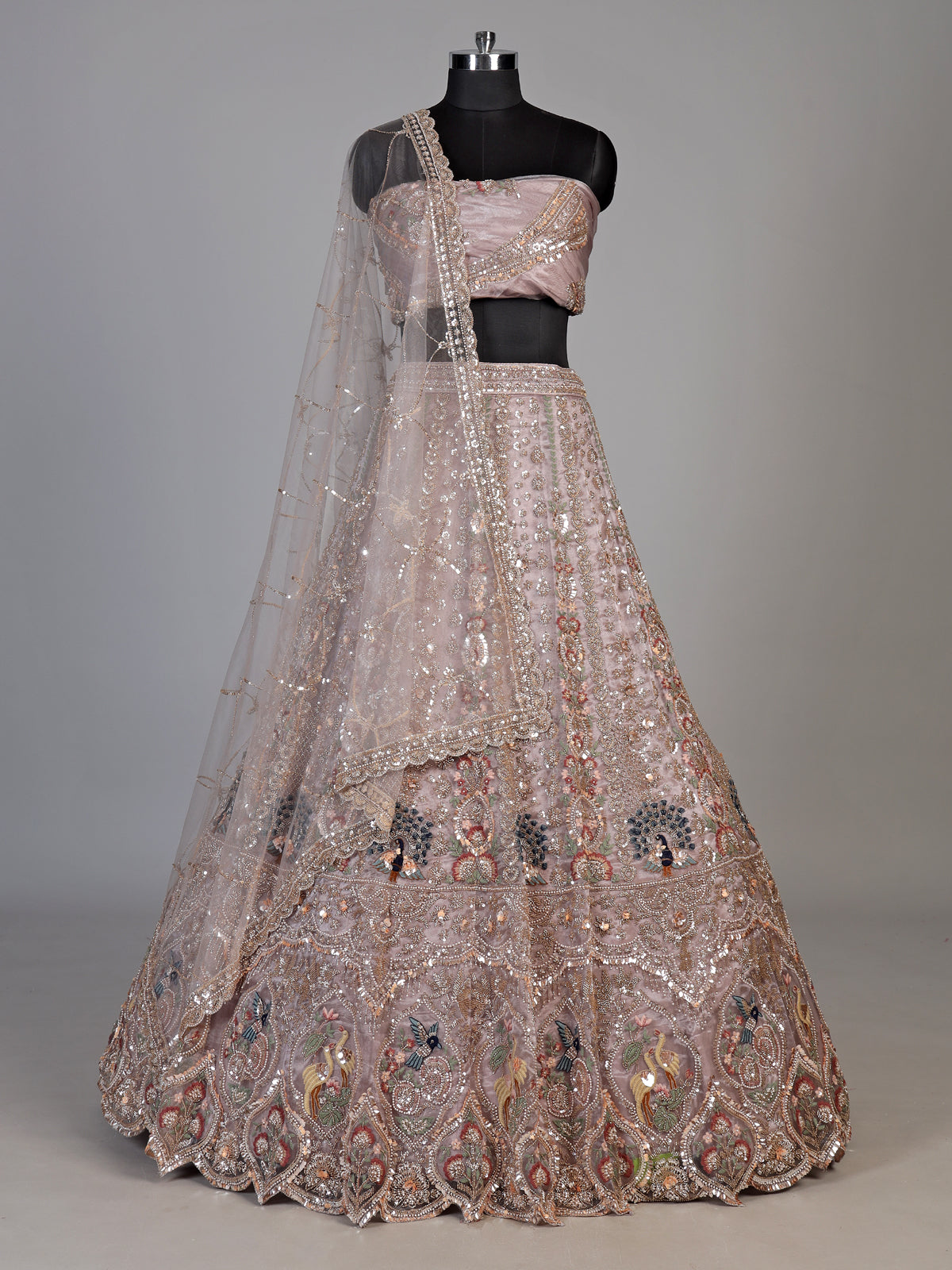 Dusty pink tissue organza unstitched lehenga choli with bird motifs