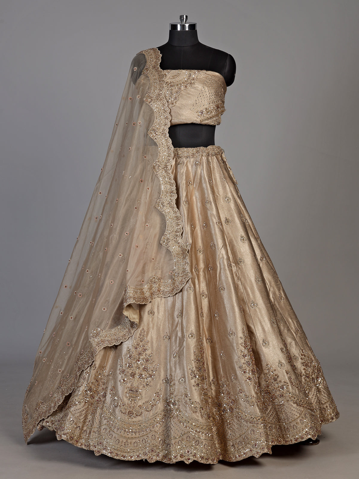 Beige silk unstitched lehenga choli with exquisite zardosi artistry