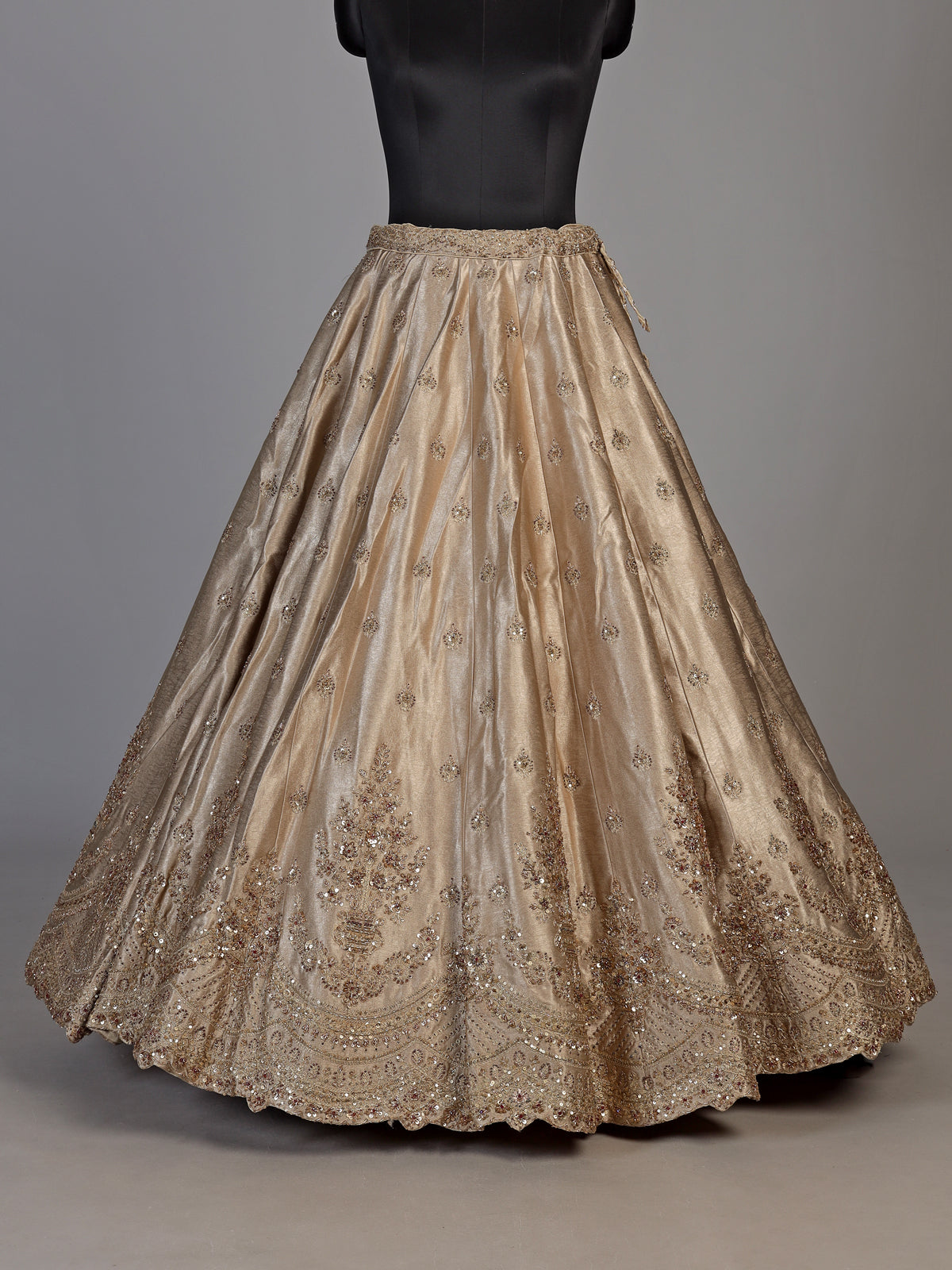 Beige silk unstitched lehenga choli with exquisite zardosi artistry
