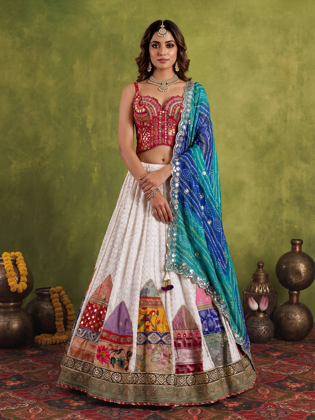 White silk blend lehenga choli with intricate traditional embellishments