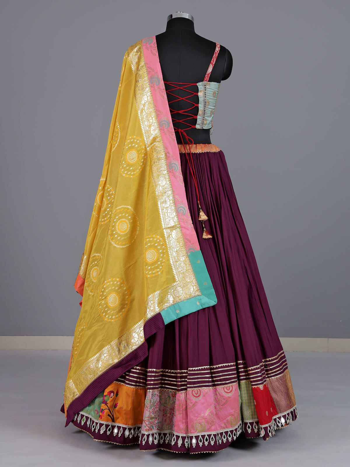 Wine pure silk blend lehenga choli with intricate floral festive detailing