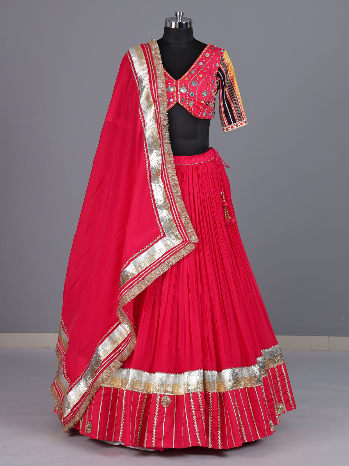 Rani pink chiffon silk lehenga choli with exquisite festive embellishments