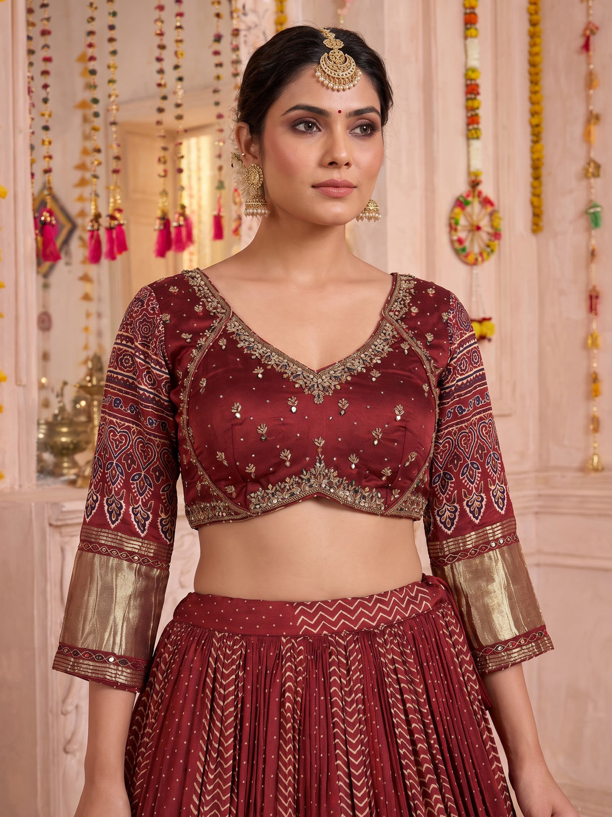 Maroon gajji silk lehenga choli with regal festive embellishments