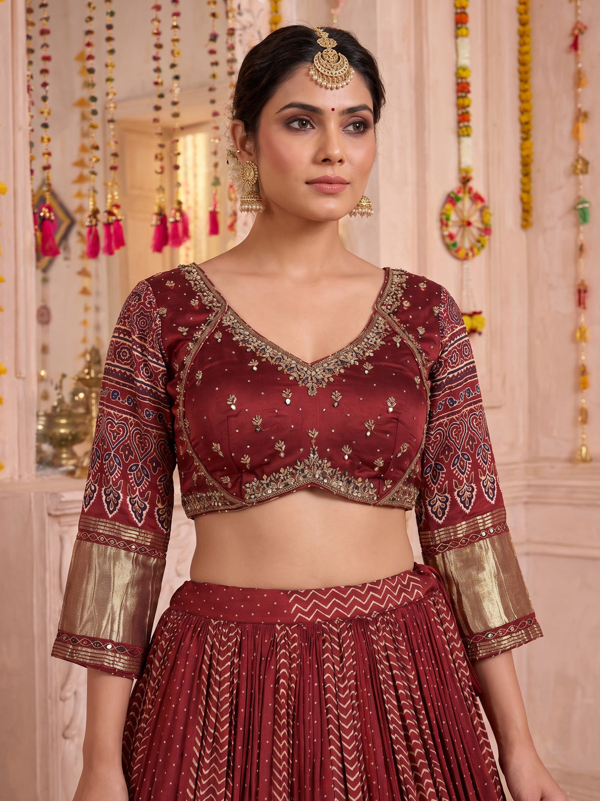 Maroon gajji silk lehenga choli with regal festive embellishments
