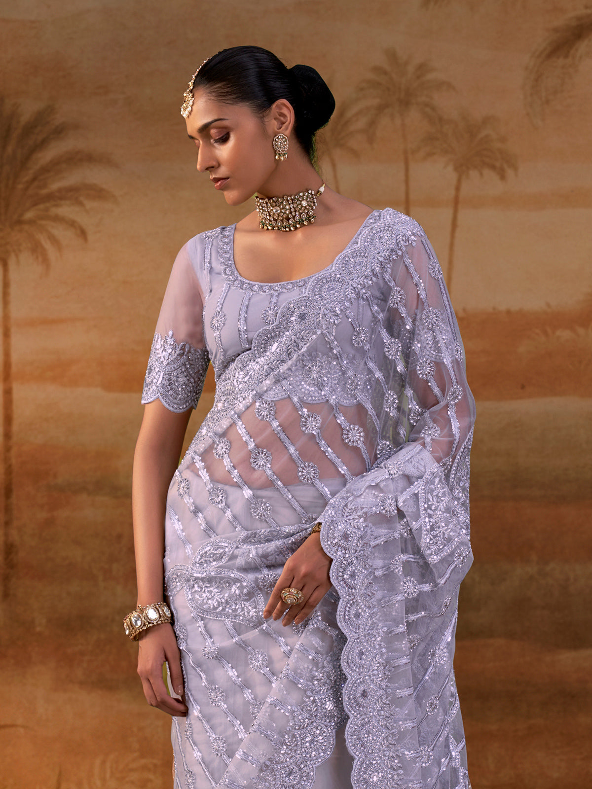 Purple net womens embellished saree with unstitched blouse