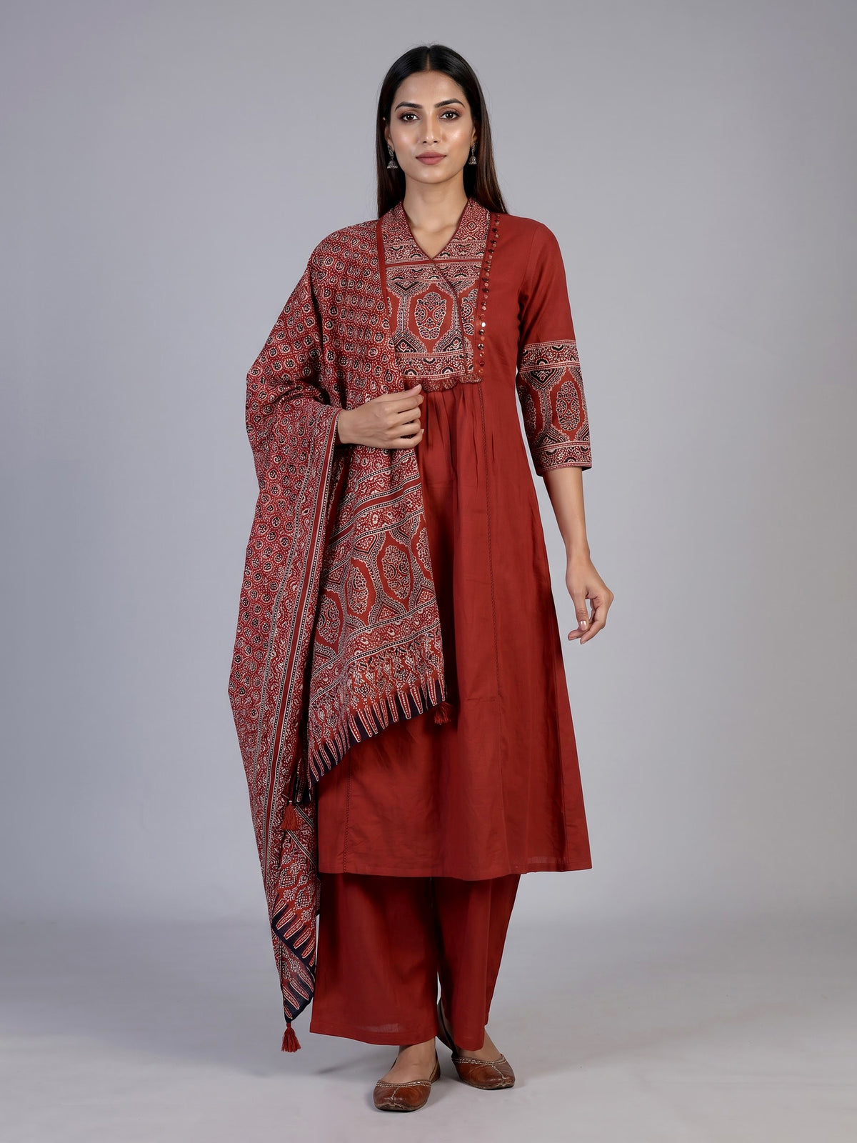 Rust red cotton blend anarkali kurti set with festive embellishments