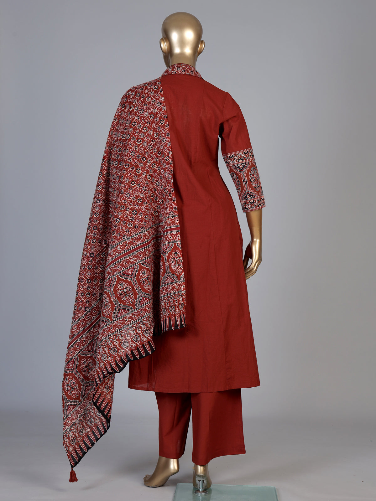 Rust red cotton blend anarkali kurti set with festive embellishments