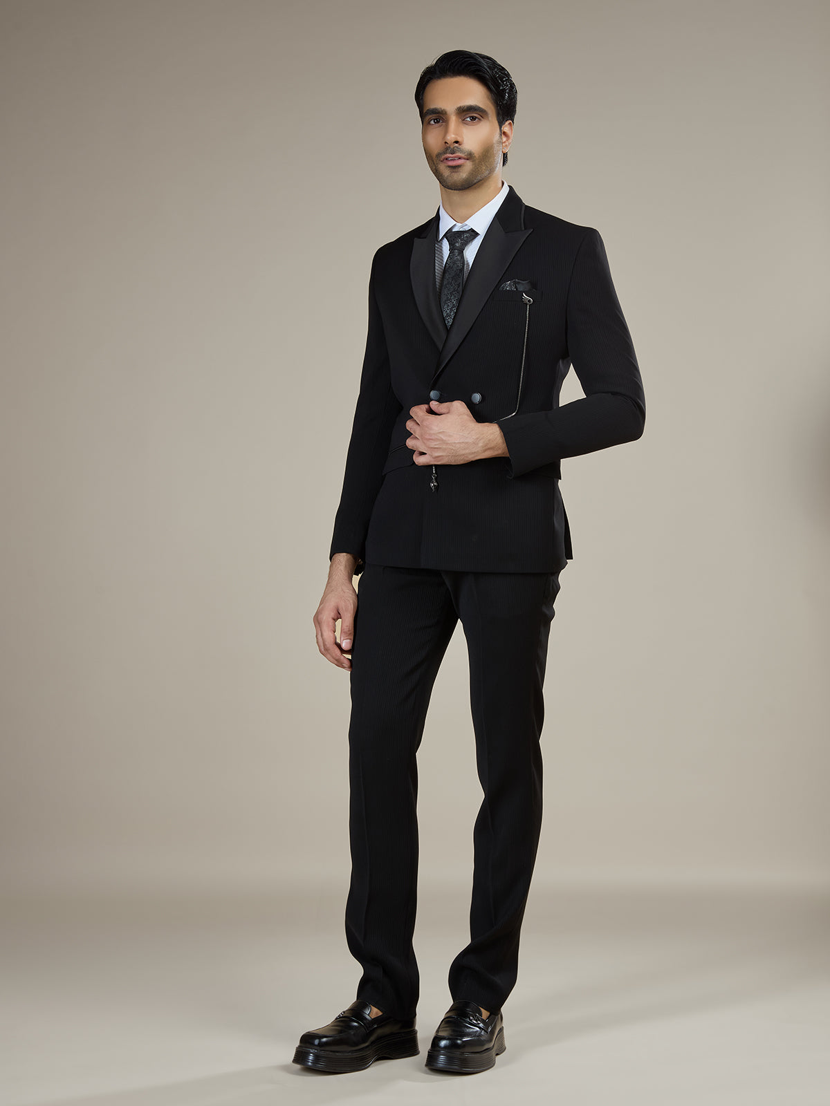 Black textured double breasted coat suit with chain detail