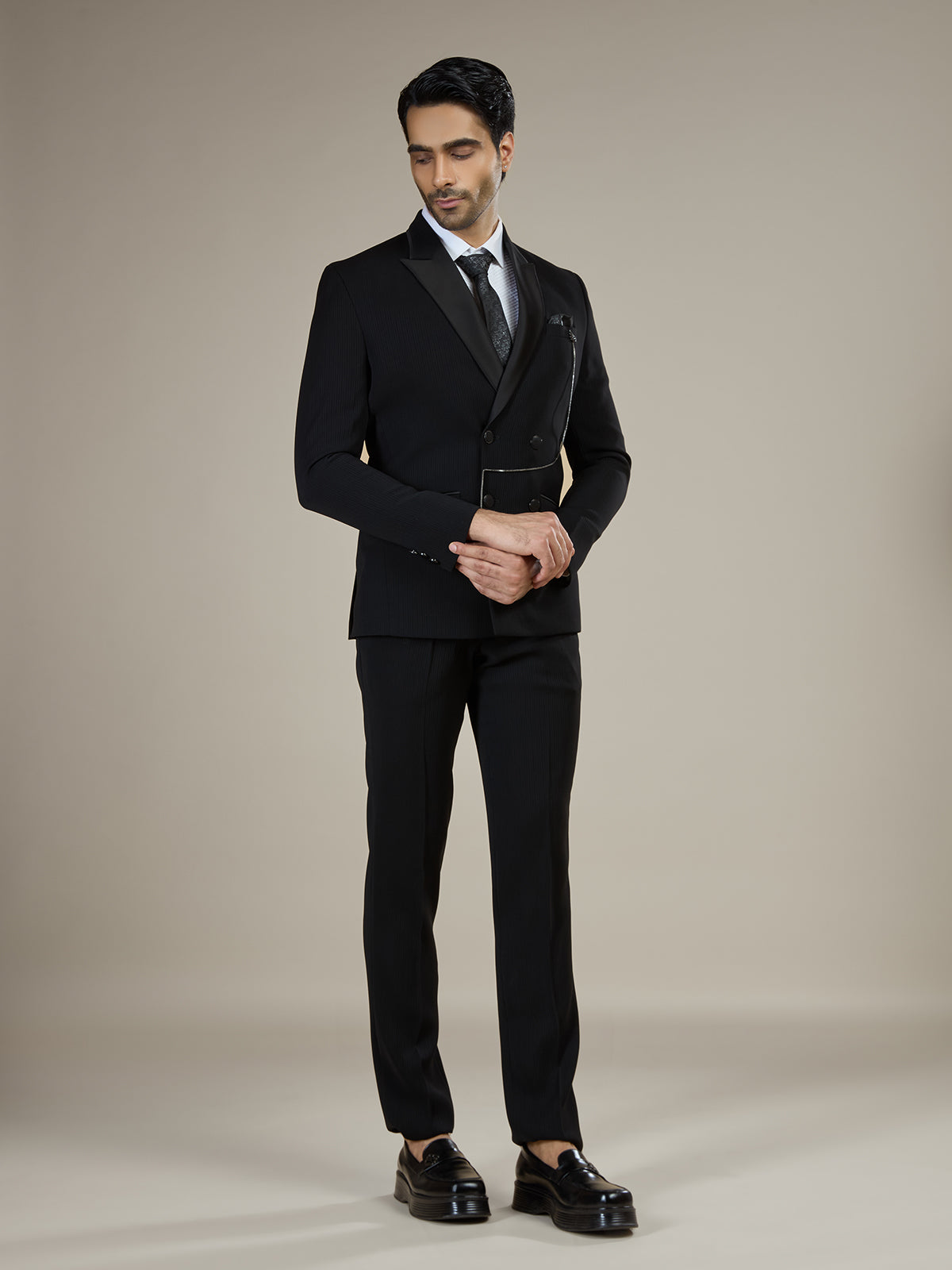 Black textured double breasted coat suit with chain detail