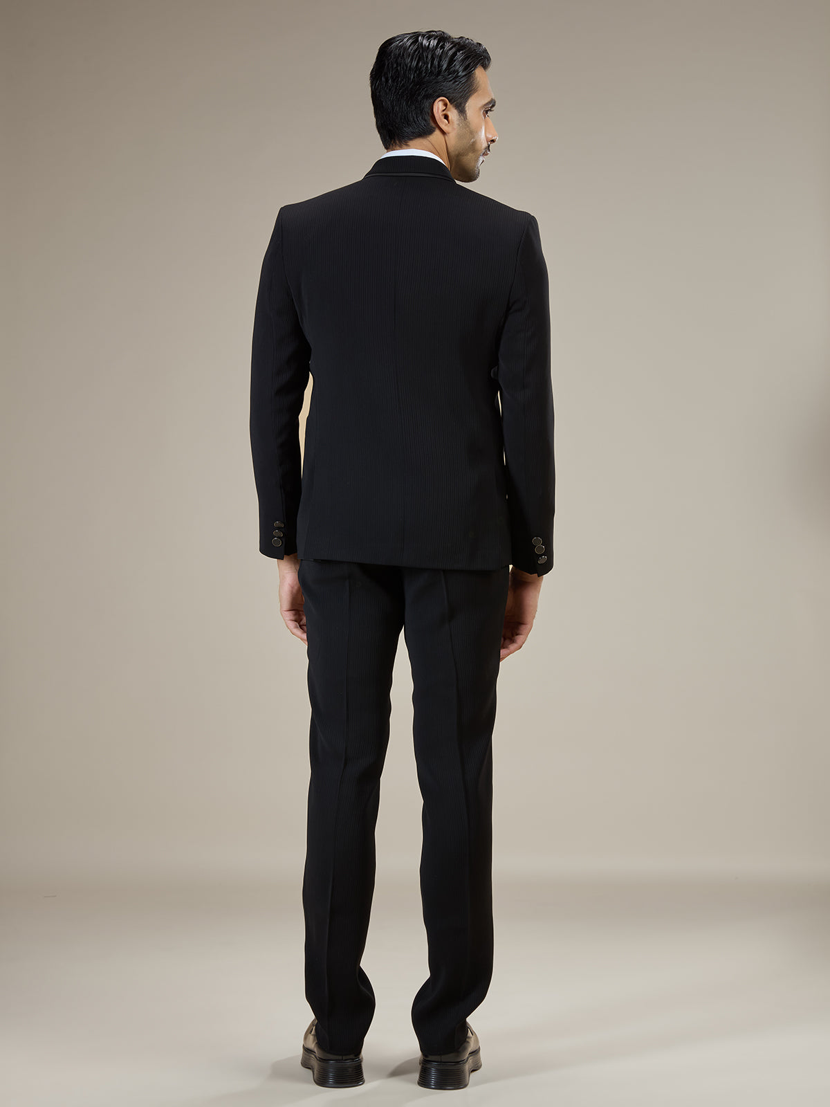 Black textured double breasted coat suit with chain detail