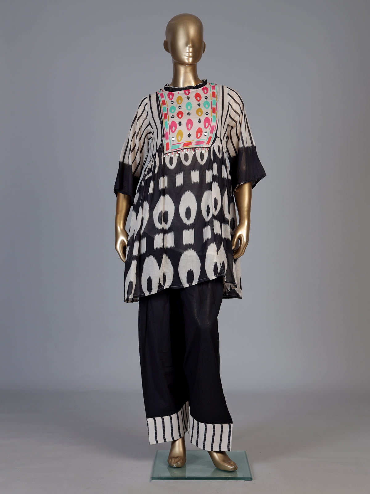 Black silk salwar suit with bandhgala neckline and ornamental detailing