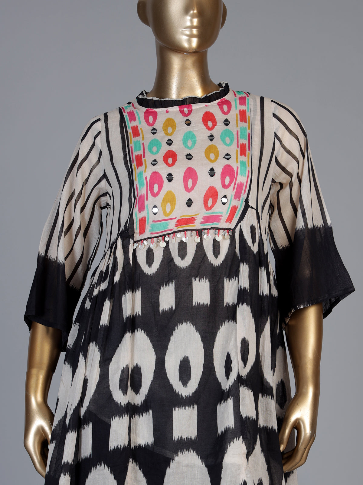 Black silk salwar suit with bandhgala neckline and ornamental detailing