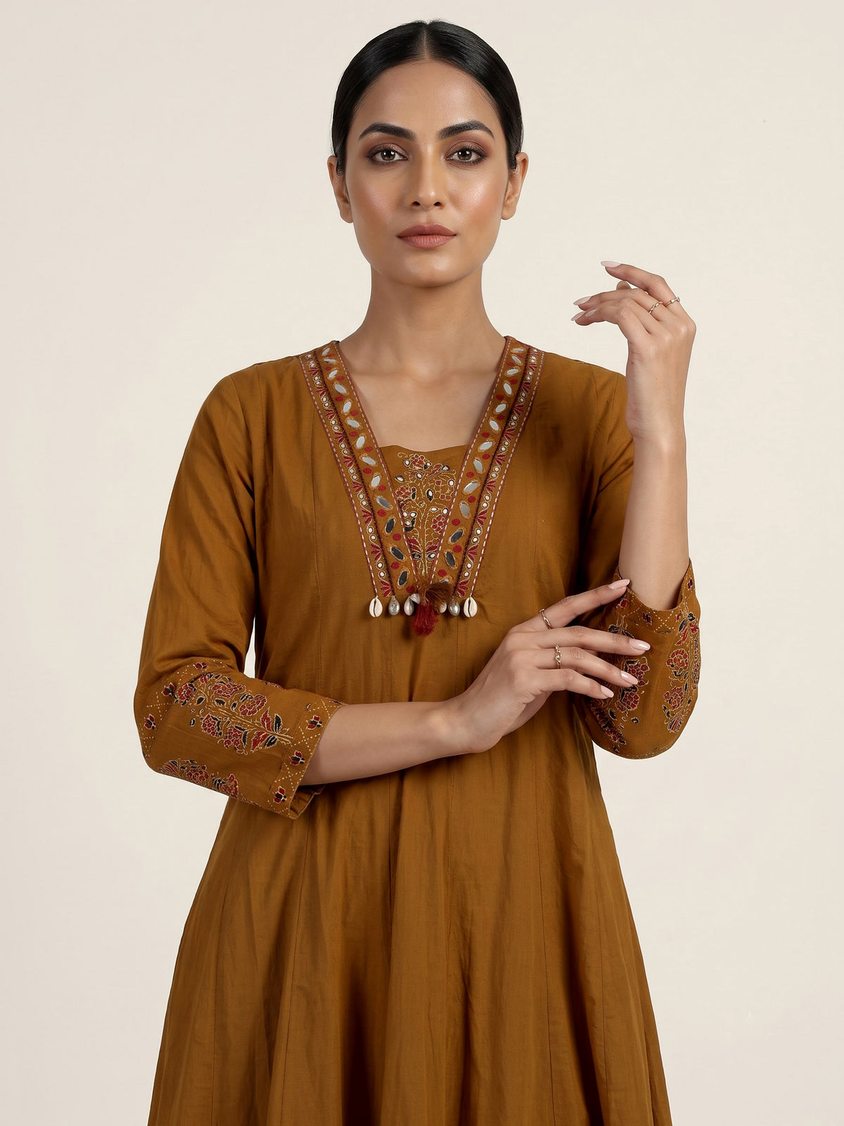 Mustard yellow cotton silk anarkali kurti set with tassel accents