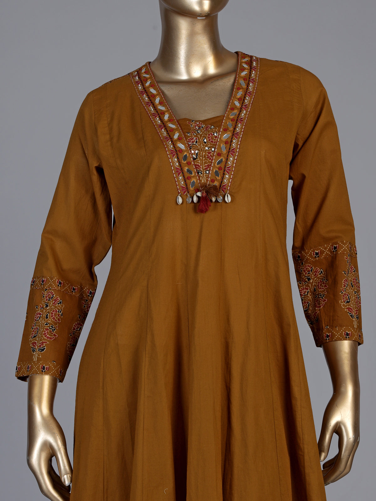 Mustard yellow cotton silk anarkali kurti set with tassel accents