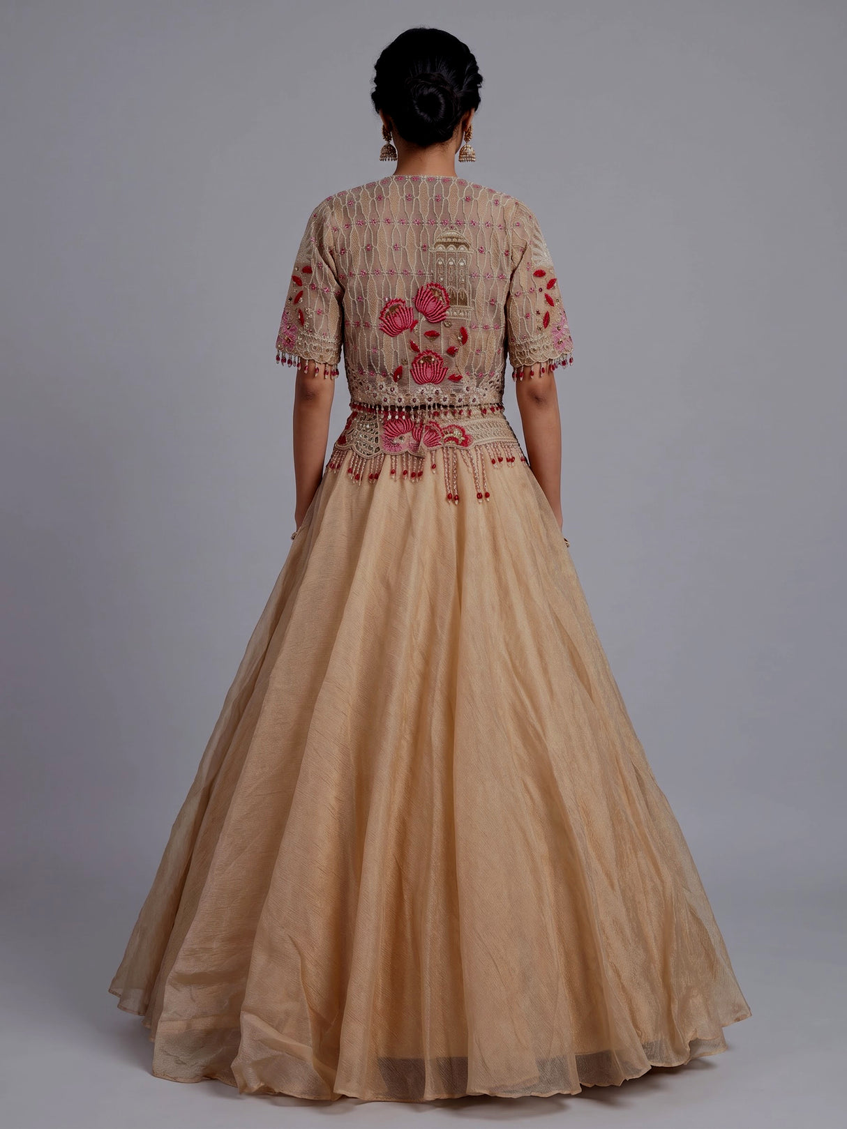Beige organza tissue lehenga choli with embroidered jacket detailing