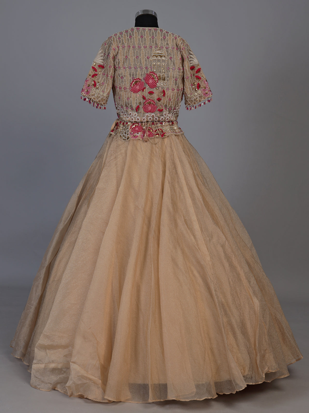 Beige organza tissue lehenga choli with embroidered jacket detailing