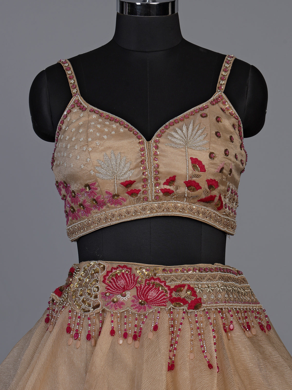 Beige organza tissue lehenga choli with embroidered jacket detailing