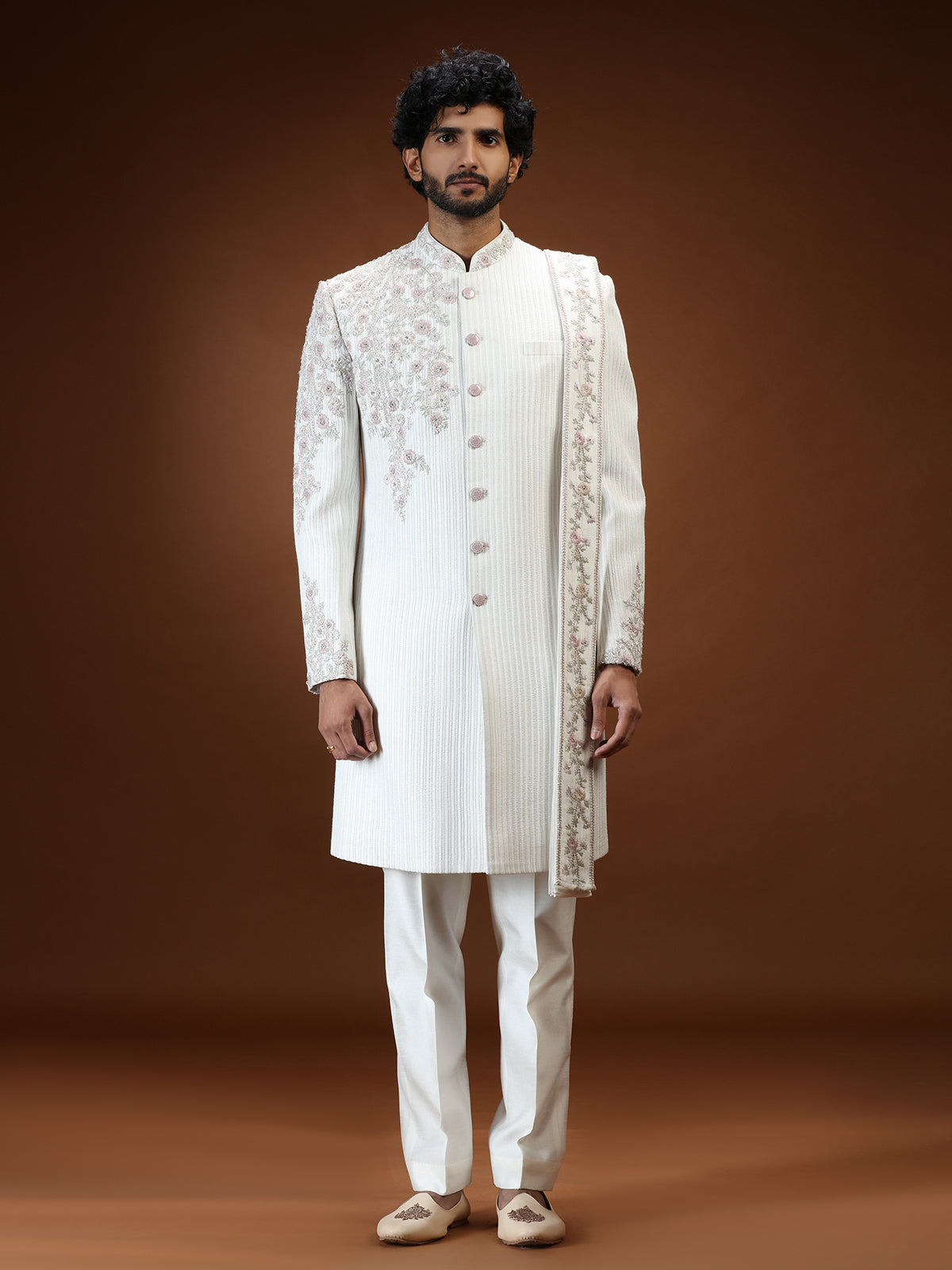 Cream silk mens sherwani with floral shoulder detailing