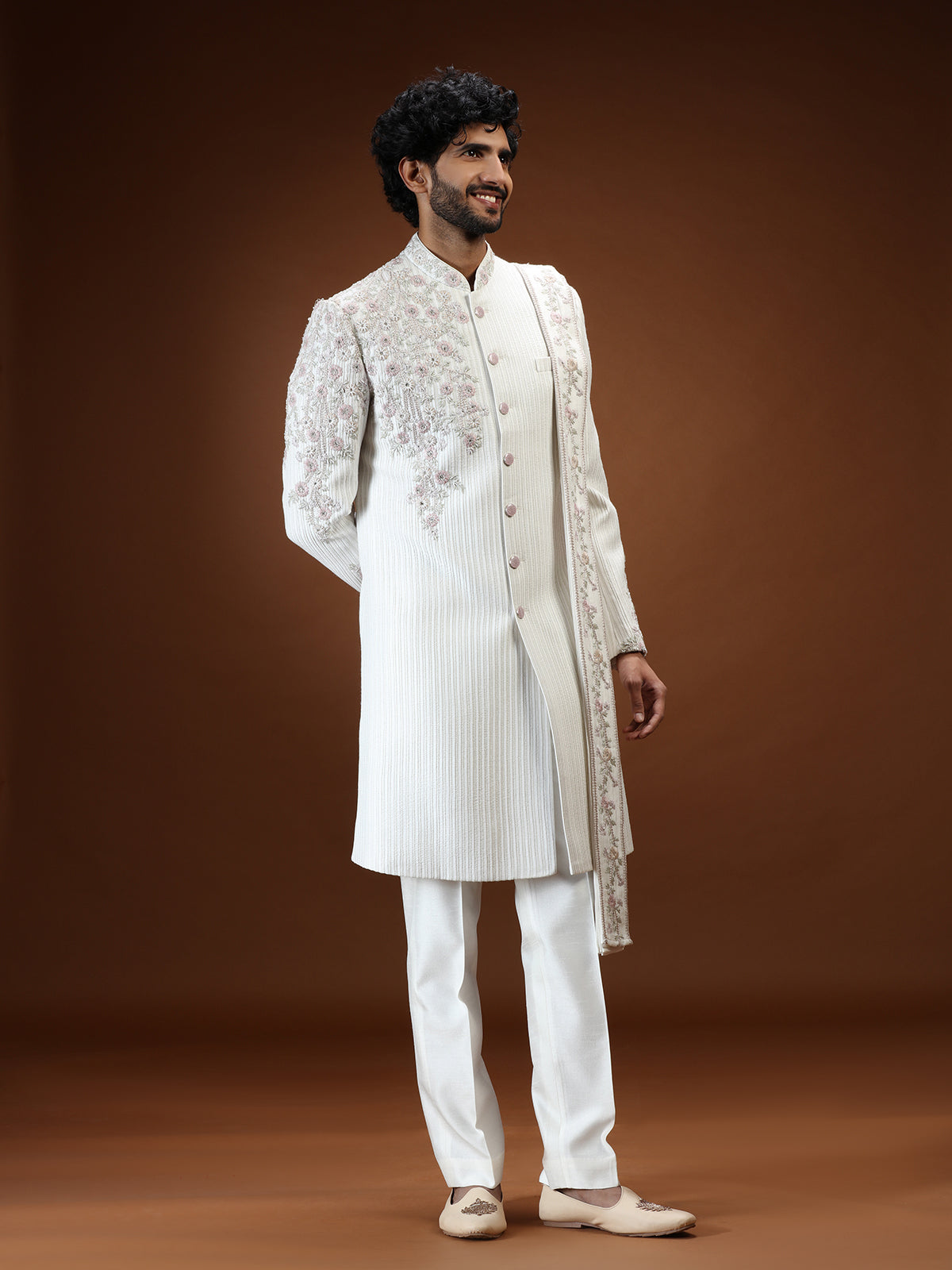 Cream silk mens sherwani with floral shoulder detailing
