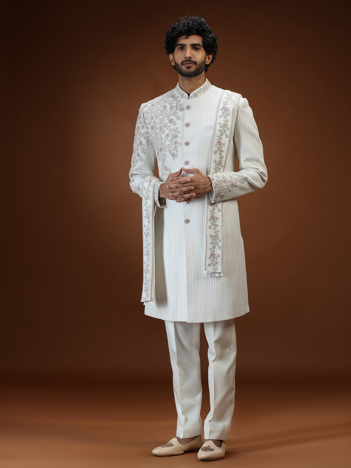 Cream silk mens sherwani with floral shoulder detailing